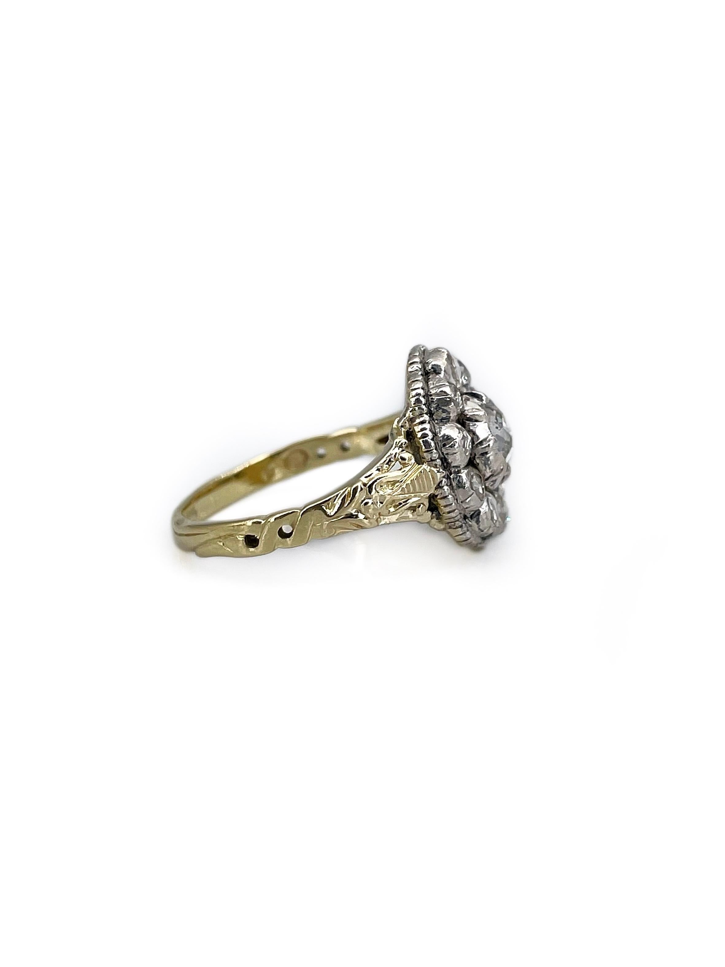 It is an amazing Victorian cluster ring crafted in 18K slightly yellow gold and adorned with silver. The piece features 11 rose cut diamonds. 

Back is closed. 

The shank of the ring has beautiful engravings. 

Weight: 4.14g
Size: 16.25 (US
