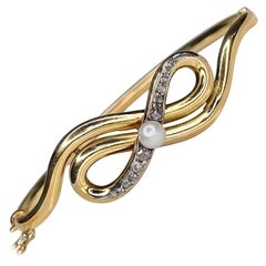 Antique Victorian 18 Karat Gold Rose Cut Diamond Pearl Bow Bangle Bracelet