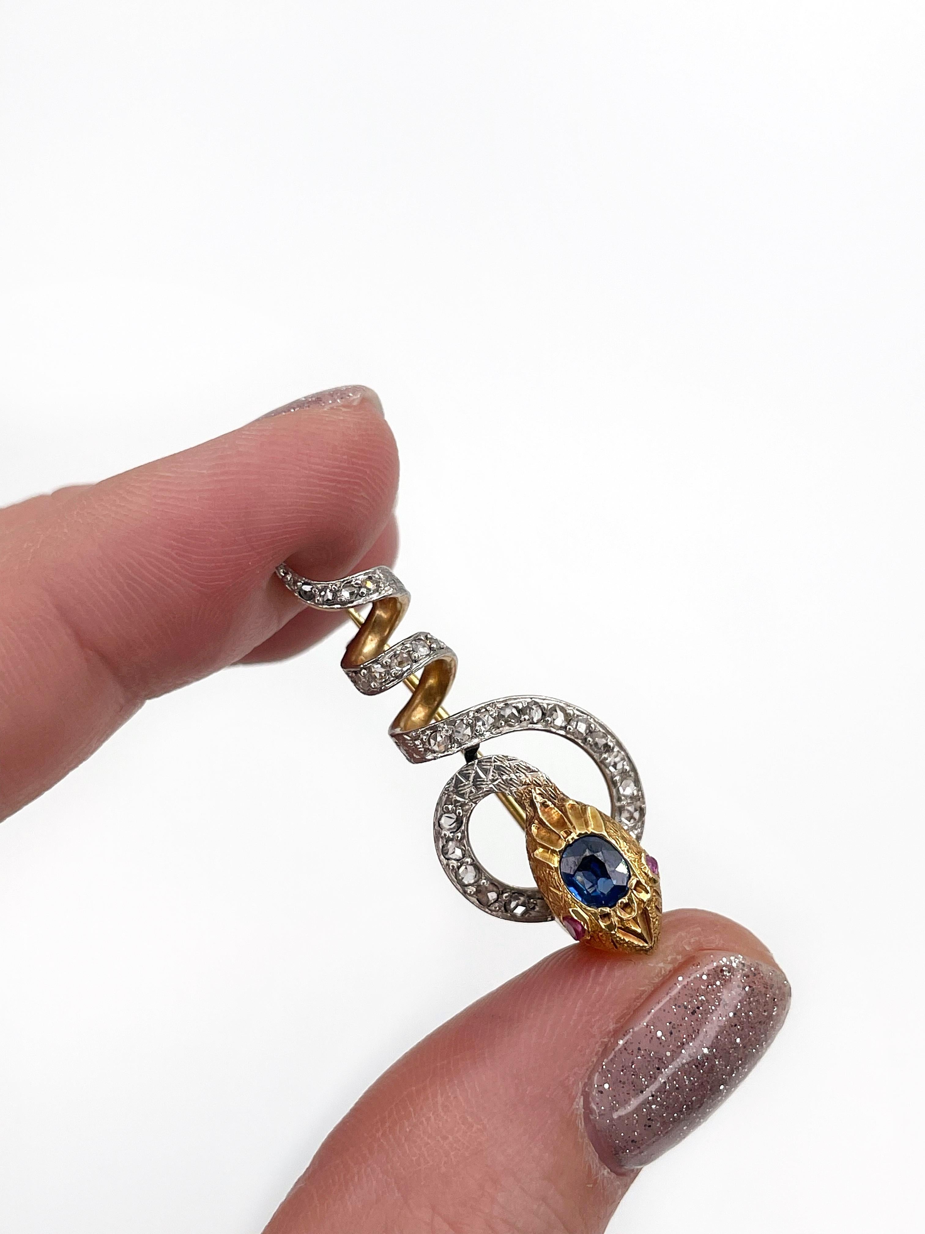 This is a beautiful antique Victorian snake pin brooch crafted in 18K gold and adorned with platinum. The piece features:
- sapphire: 1pc., oval, faceted, 0.60ct, vB 3/3, SI, H
- rubies: 2pcs., rose cut, 0.01ct, stpR 2/4, SI
- diamonds: 25pcs., rose