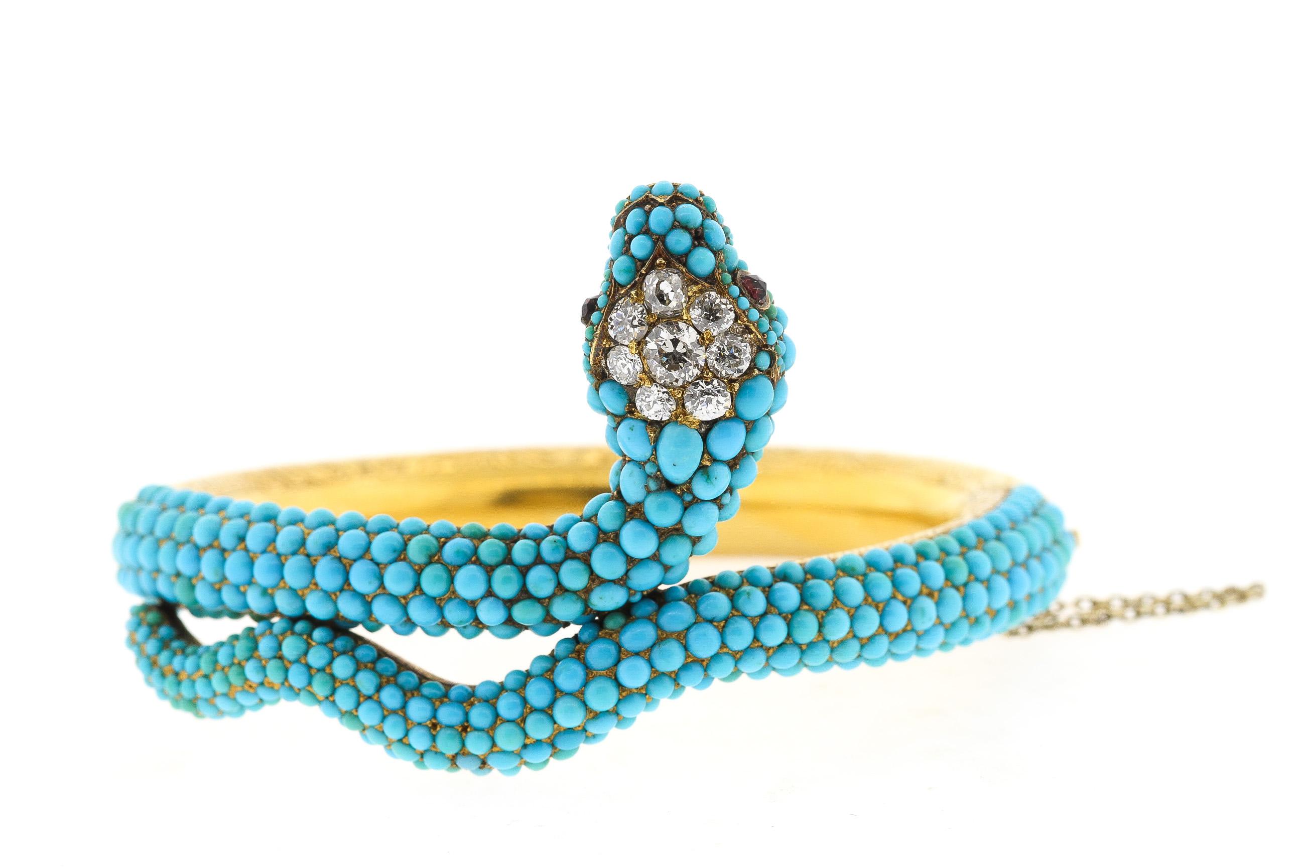 A rare antique Victorian turquoise, and diamond snake bangle bracelet, circa 1880. This bracelet hinges open, the hollow form gold back is beautifully engraved. The top part of the bracelet is set with pave turquoise that are in great condition. The
