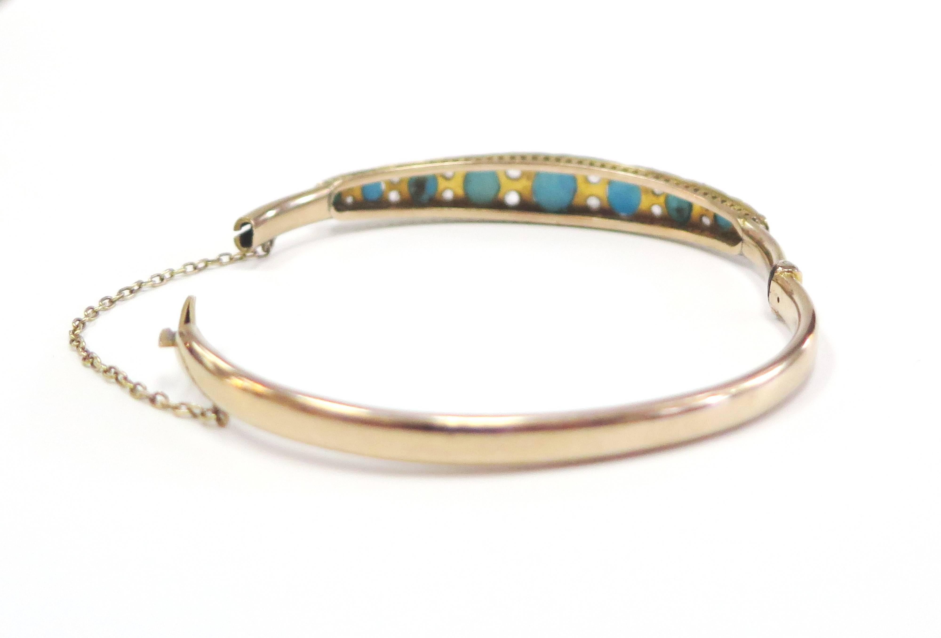 Nine deep rich graduated turquoises, separated by a pair of glittering rose cut diamonds, in this rare, wonderful and very wearable bangle, handcrafted in 14 Karat yellow gold. A colorful and timeless antique Victorian bangle bracelet from the
