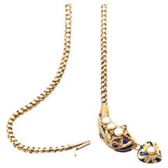 Collier serpent victorien ancien des années 1850 en or 18 carats, émail bleu, perles et grenats