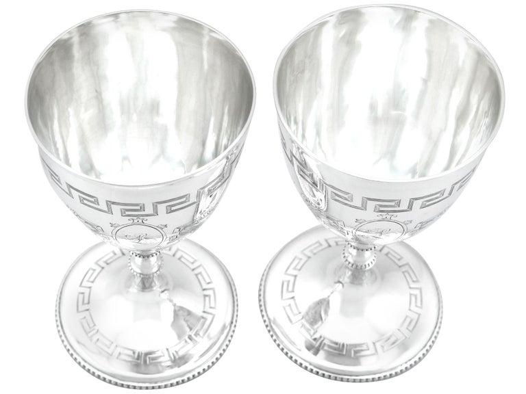 An exceptional, fine and impressive pair of antique Victorian English sterling silver goblets; an addition to our range of wine and drink related silverware

These exceptional antique Victorian sterling silver goblets have a plain circular bell