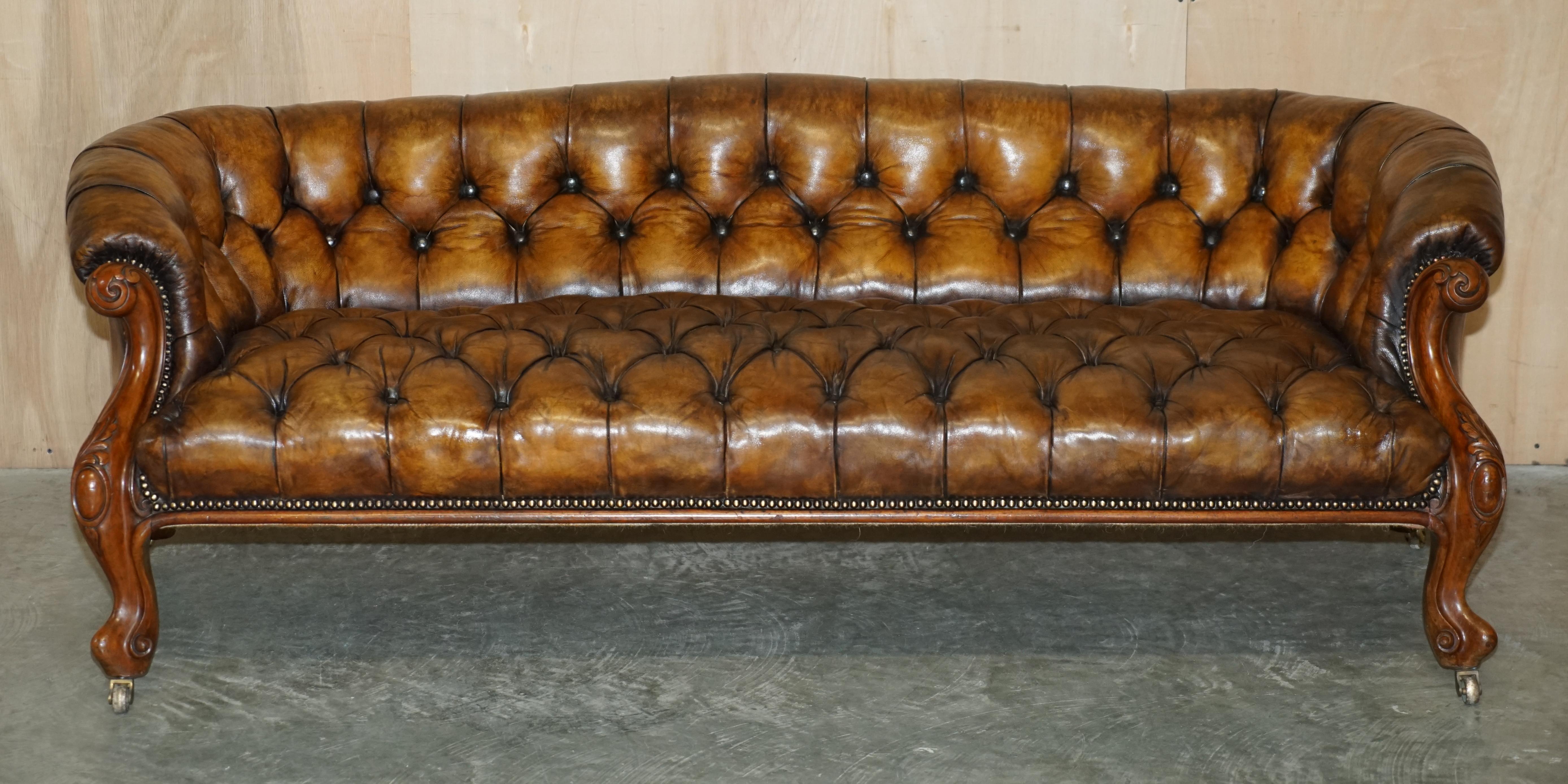 We are delighted to offer for sale this stunning fully restored Victorian hand dyed cigar brown leather Chesterfield tufted club sofa with hand carved walnut Show Frame 

This sofa is as rare as they come, it’s a period original Victorian which is