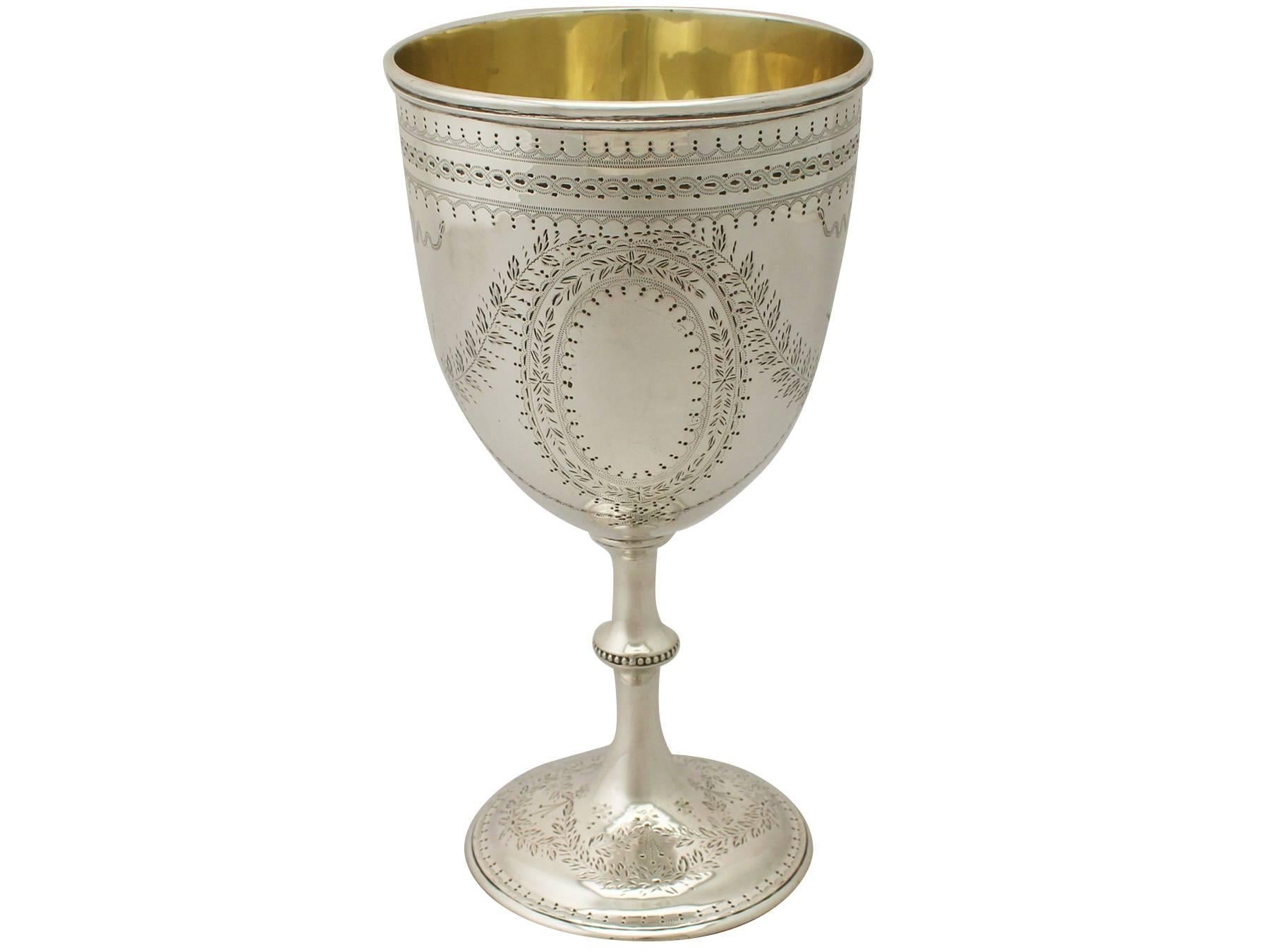 An exceptional, fine and impressive, large antique Victorian English sterling silver goblet: an addition to our collection of wine and drinks related silverware.

This exceptional antique Victorian sterling silver goblet has a circular bell shaped