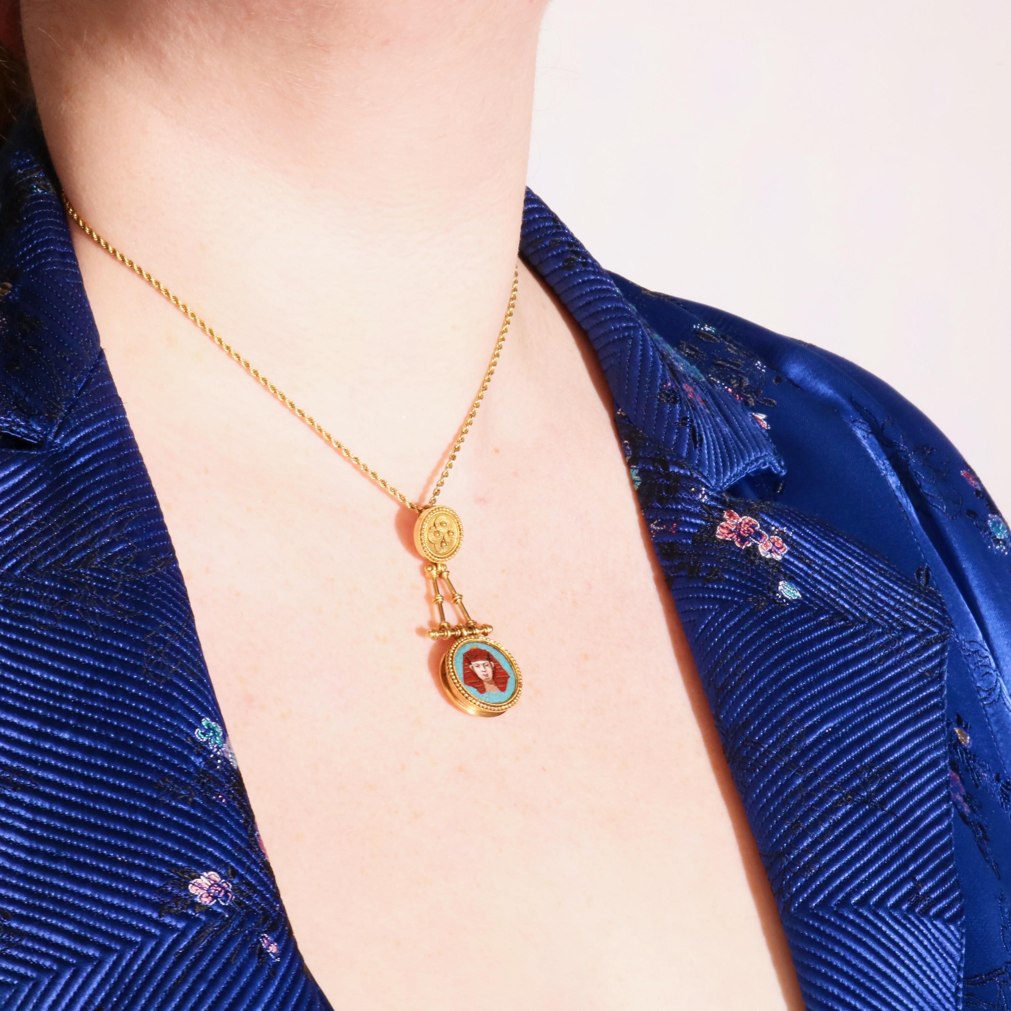 An antique yellow gold, and micro mosaic pendant, comprising tiny mosaic panels in varying vibrant colours, set in 18 karat yellow gold, with 18 karat yellow gold fittings. 

This pendant contains a beautiful, extremely fine depiction of an Egyptian