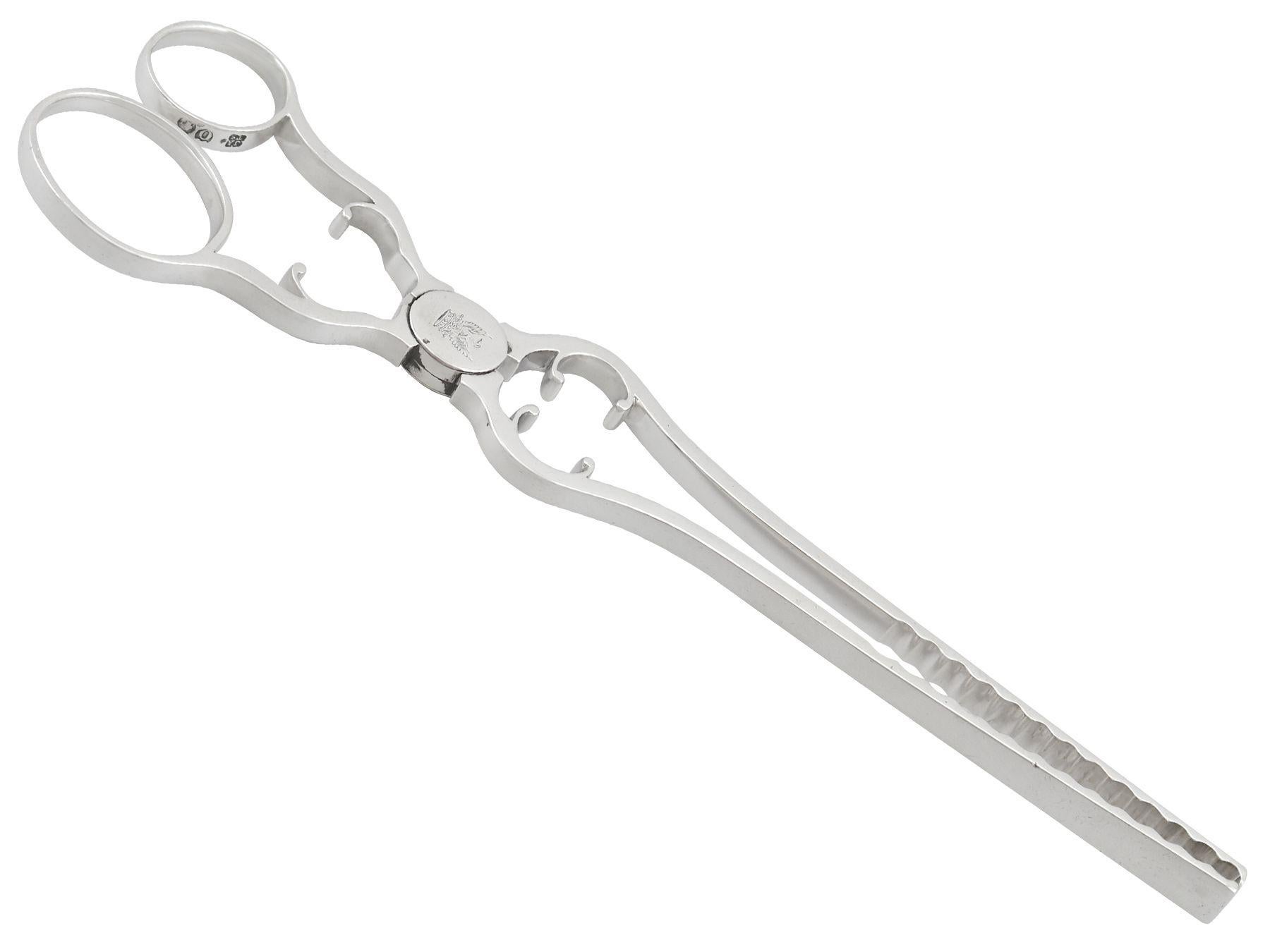 An exceptional, fine and impressive pair of antique Victorian English sterling silver asparagus tongs; an addition to our silver flatware collection

These exceptional, fine and impressive antique Victorian sterling silver asparagus tongs have a