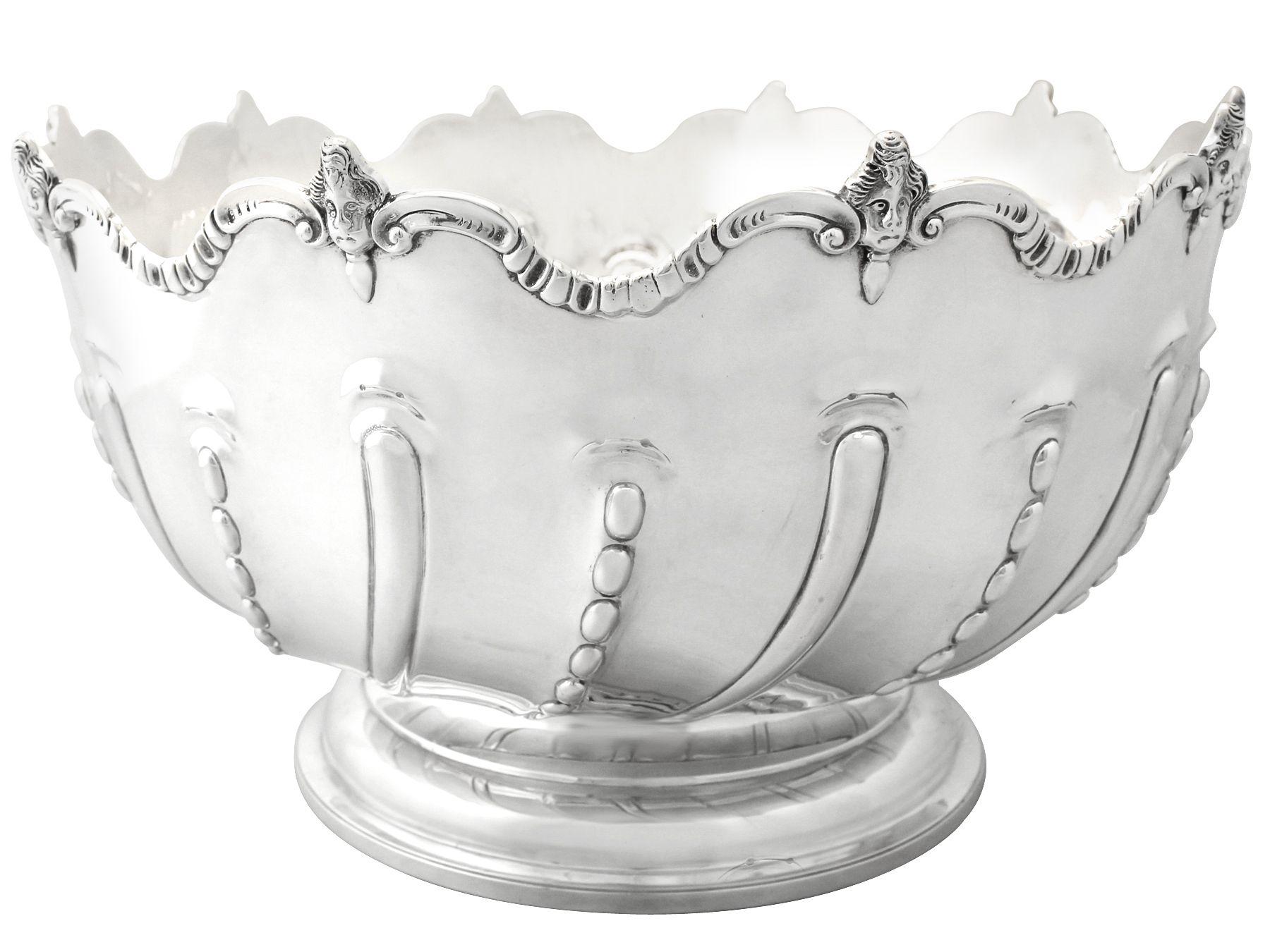 A magnificent, fine and impressive, large antique Victorian English sterling silver Monteith style presentation bowl; an addition to our ornamental silverware collection.

This magnificent antique Victorian Monteith style silver bowl, crafted in