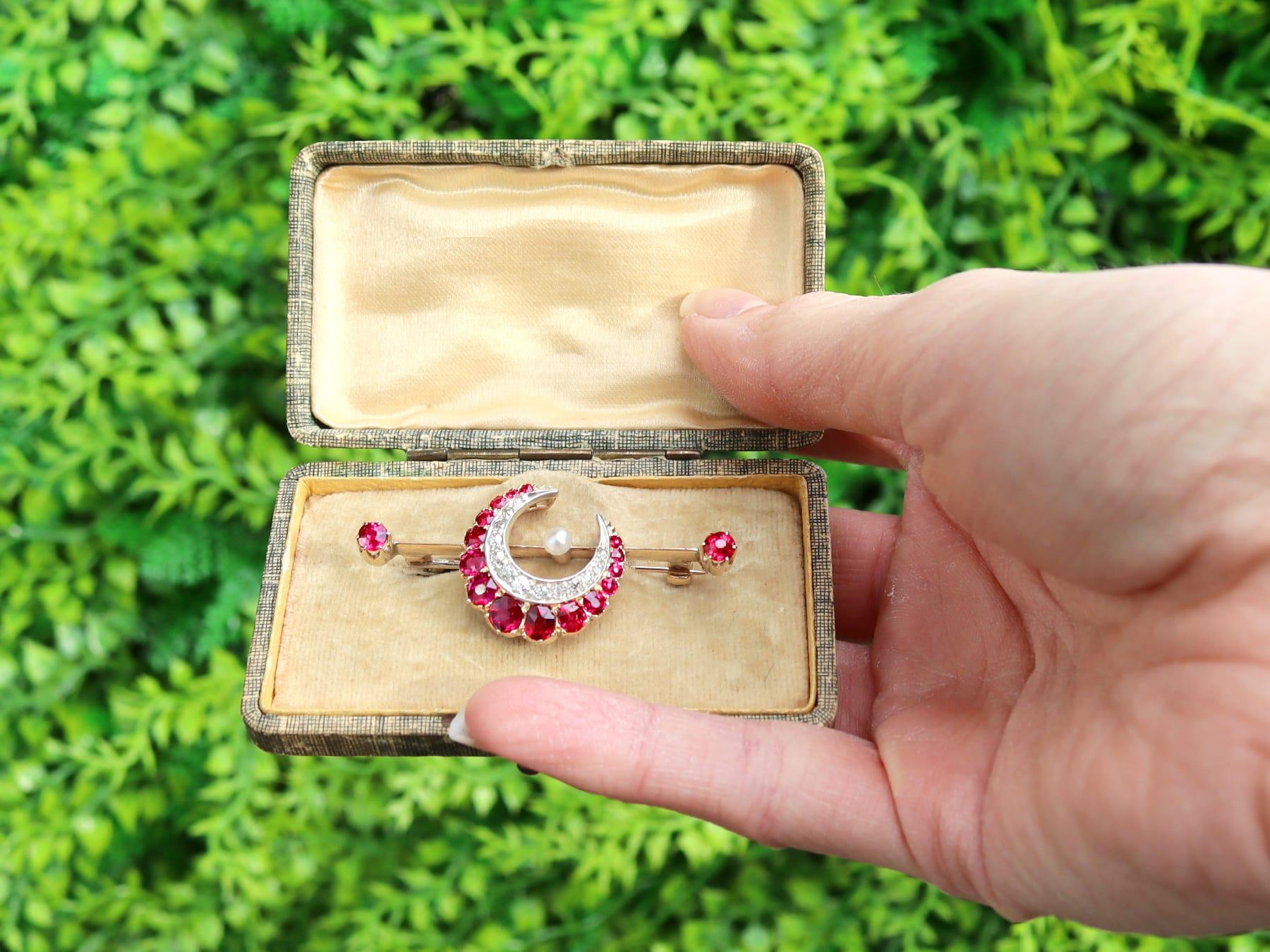 A stunning 2.38 carat ruby and 0.30 carat diamond, pearl and 14 karat yellow gold, 14k white gold set 'Crescent' bar brooch; part of our diverse antique jewelry collections.

This stunning, fine and impressive antique crescent moon brooch has been