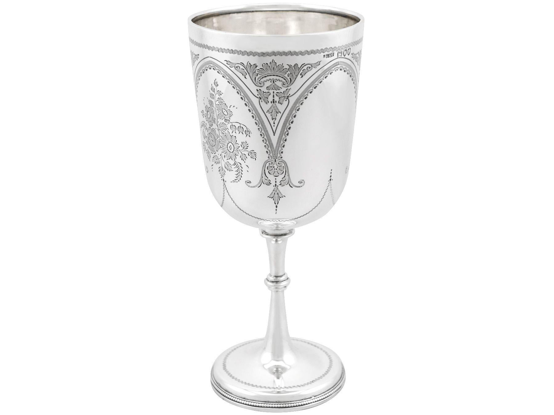 An exceptional, fine and impressive antique Victorian English sterling silver goblet; an addition to our collection of wine and drinks related silverware.

This exceptional antique sterling silver goblet has a circular bell shaped form onto a