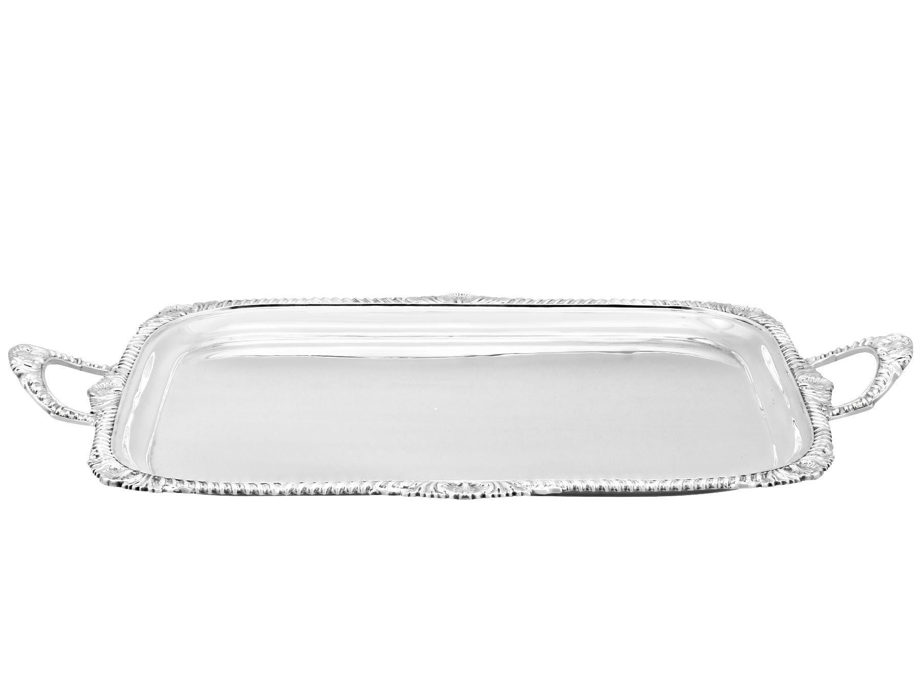 An exceptional, fine and impressive antique Victorian English sterling silver tray; an addition to our range of silver trays, salvers and plates

This exceptional antique Victorian sterling silver tray has a rectangular shaped form with rounded