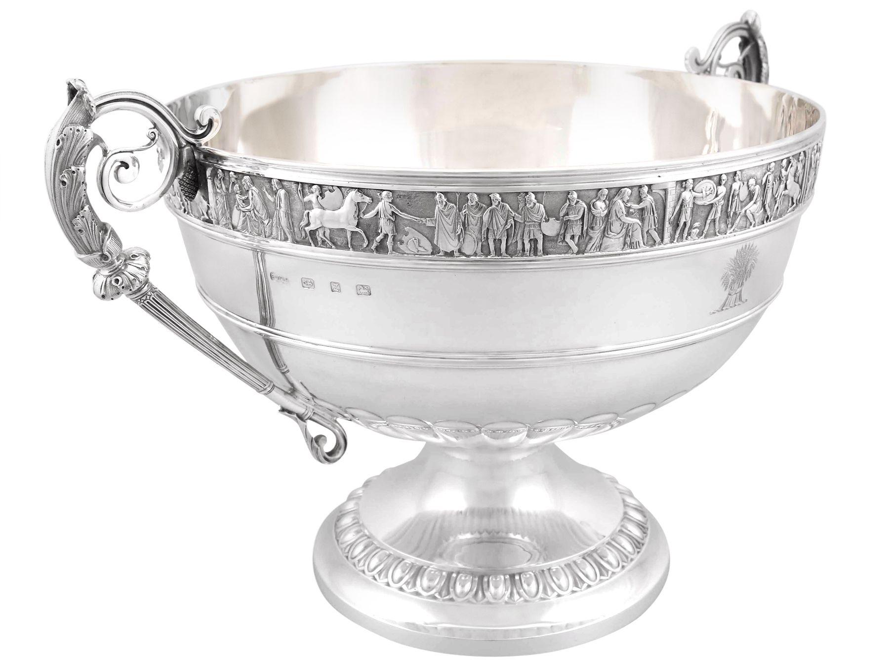A magnificent, fine and impressive, large Victorian English sterling silver presentation bowl made by Elkington & Co Ltd; an addition to our ornamental silverware collection.

This magnificent Victorian English sterling silver bowl has a circular
