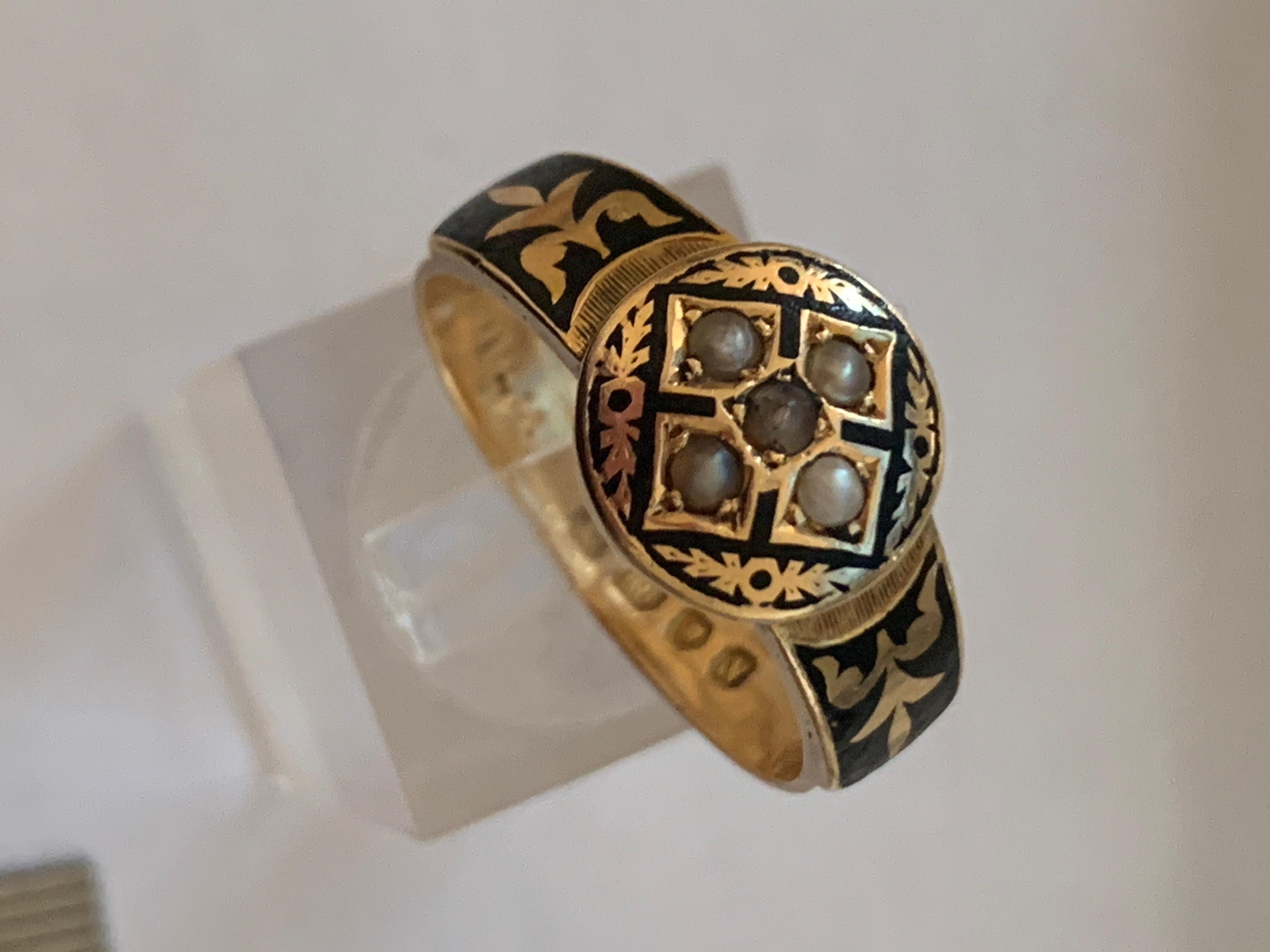 Beautiful Victorian Antique  
18ct Gold Memorial Ring 
set with fresh water pearls to the front.
& with black enamel that wears away on the back of the band .

The pearl in the centre has some surface damage - visible under an eye loop

inside the