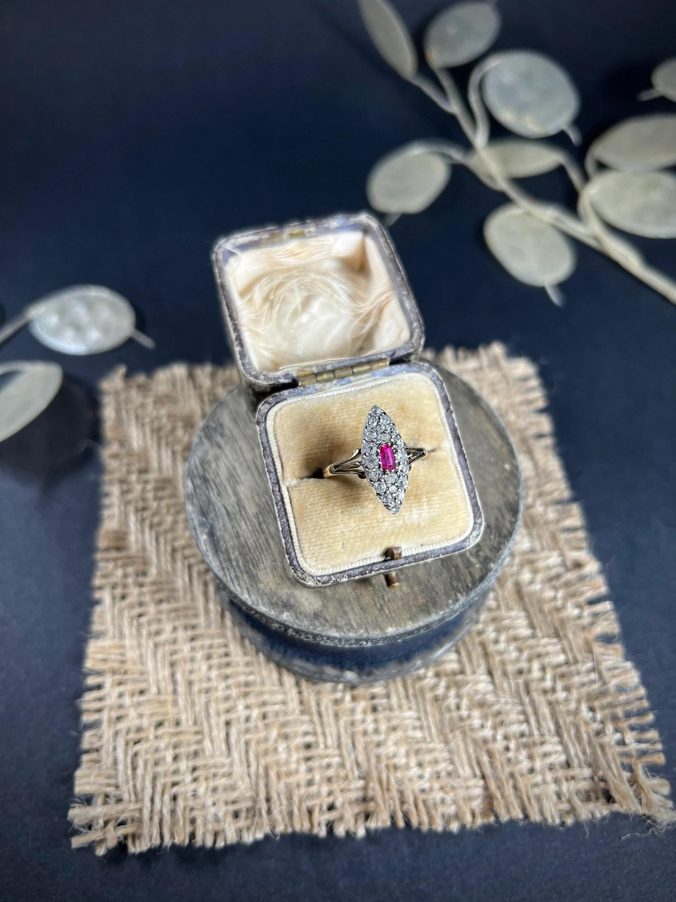 Antique Ruby & Diamond Marquise Ring 

18ct Gold Tested

Circa 1880 

Fabulous, Victorian marquise/navette shaped ring. Set with a rectangular, natural ruby & beautiful natural diamonds. The stones are set in white gold & mounted on a lovely 18ct
