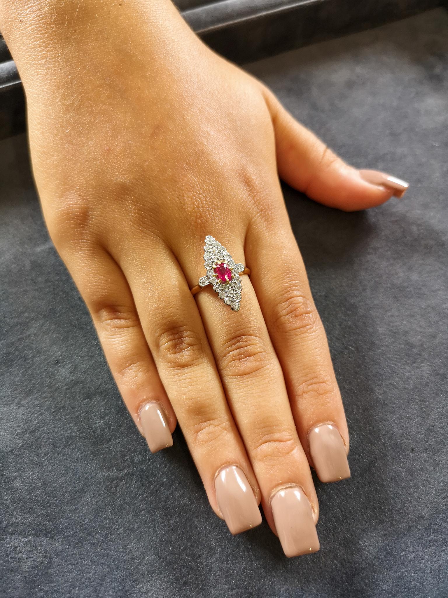 A stylish cluster ring typical of the Late Victorian period, circa 1880. Featuring a central blood-red oval ruby of approximately 0.30 of carat, mounted in a navette shaped setting, which is pavé-set with old-cut diamonds. A single diamond in each