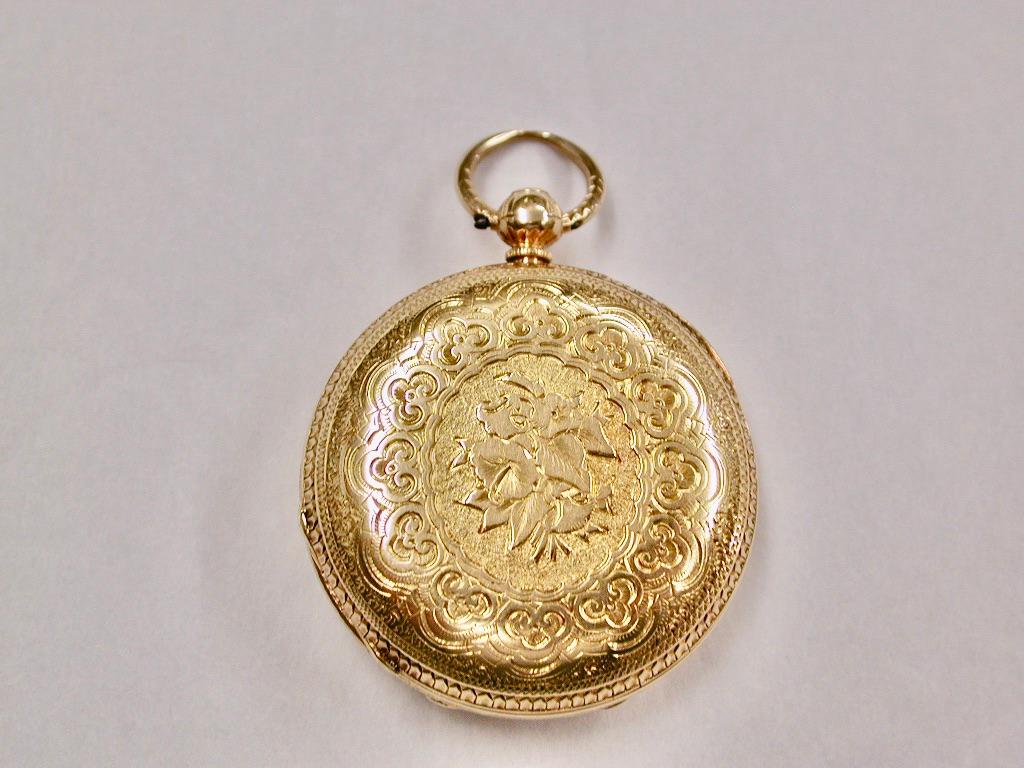 Antique Victorian 18ct Hunter Pocket Watch,Hallmarked In Chester,1867
This chain driven movement was made by Henry Westrap of Stow and London
The watch face is made of silver with applied gold work in the centre and edges.
The hand engraving of the