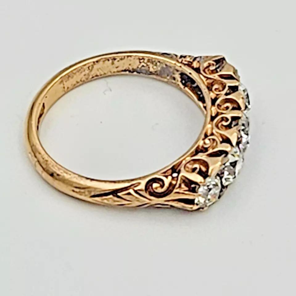 Antique Victorian 18ct Solid Gold, Carved Half Hoop Five Stone Diamond Ring

A really beautiful 18ct gold ring that was made circa 1880-1900. It has been claw set with five well matched bright white transition cut diamonds. The total estimated