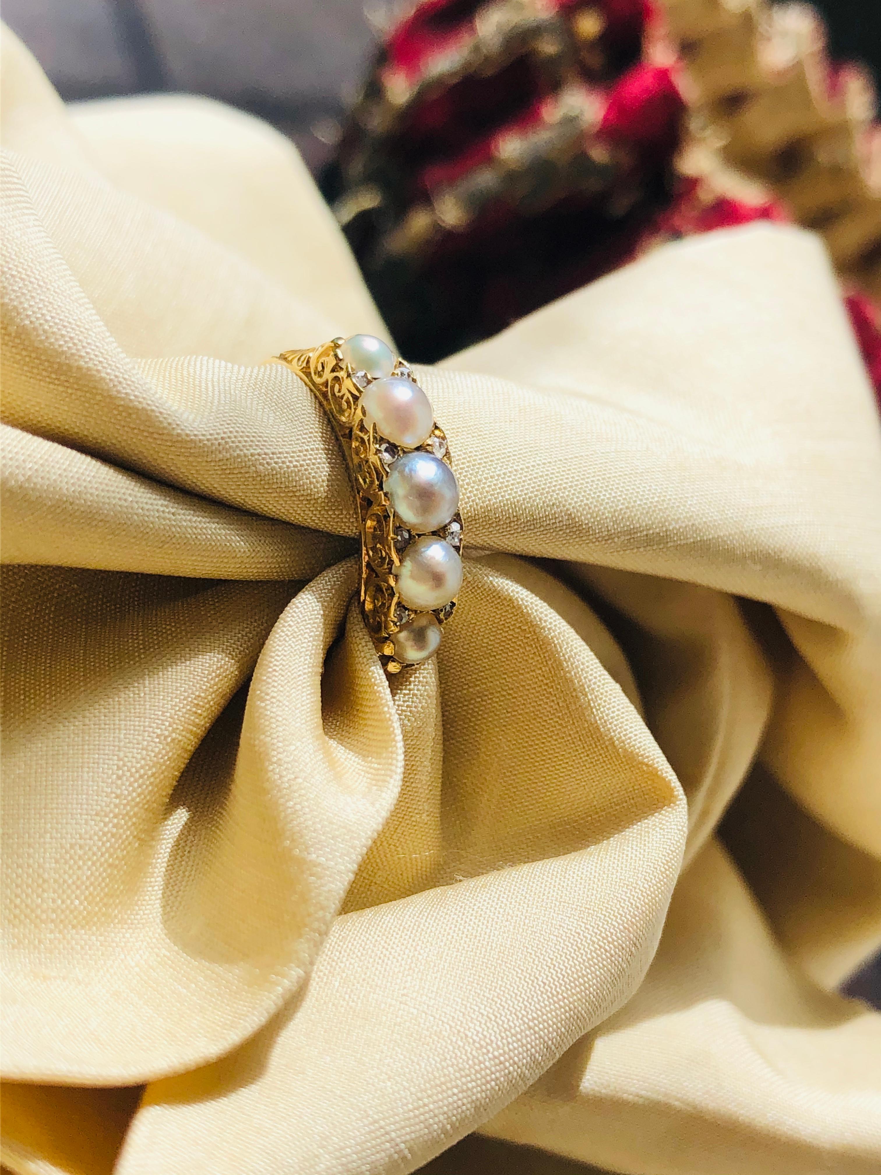 Victorian, natural pearl half hoop ring, circa 1890. 

Set with five luscious natural half pearls in a simple but beautifully executed 18ct yellow gold setting with rose-cut diamonds interspersed. Each pearl is secured by ornately carved claws. It