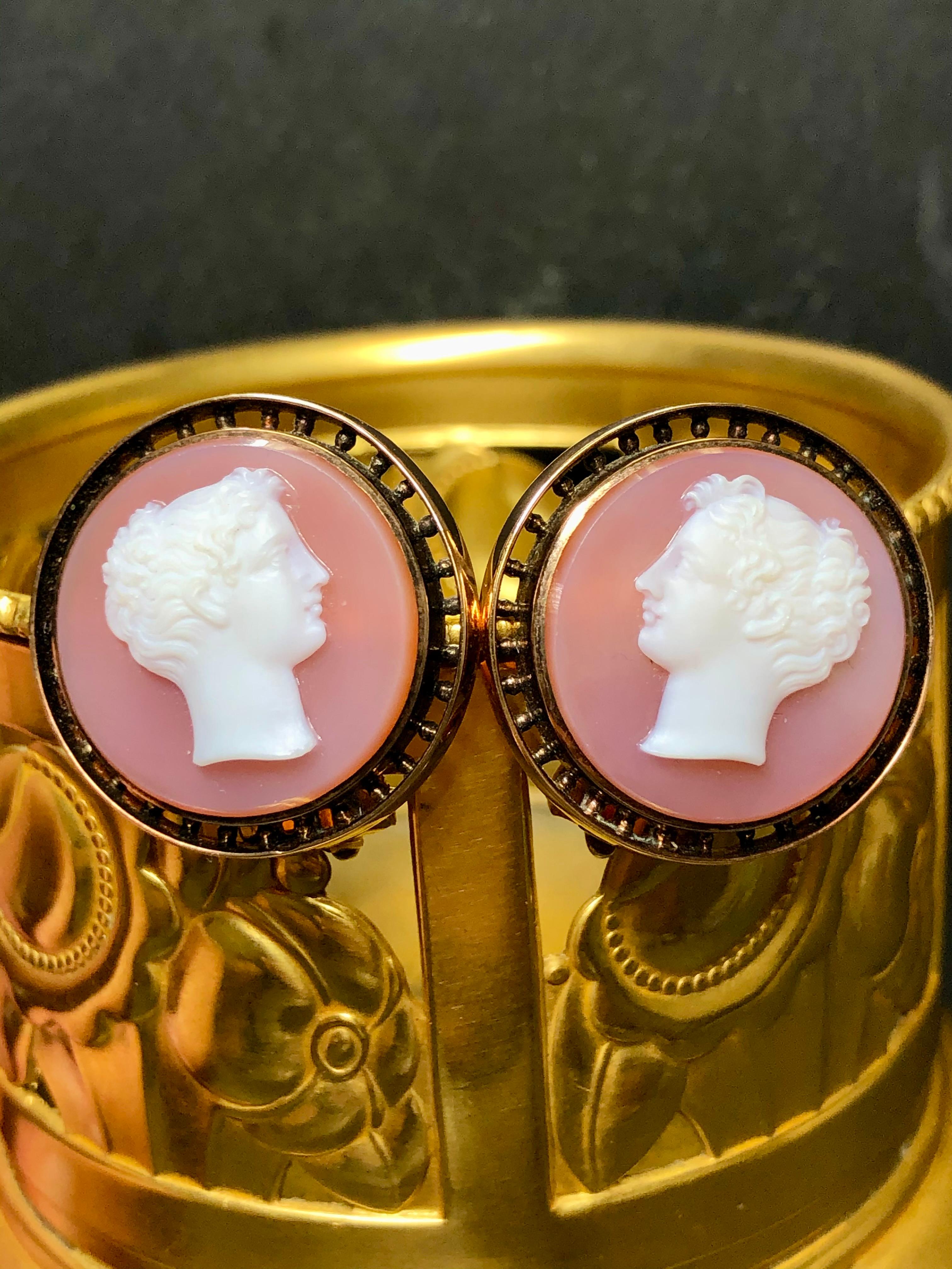 An original pair of Victorian earrings done in 18K (14k backs) and centered by high relief hardstone cameos carved out of carnelian. Backs are clip-on.


Dimensions/Weight:

Earrings measure 1” in diameter and weigh 13.2g.


Condition:

Stones are
