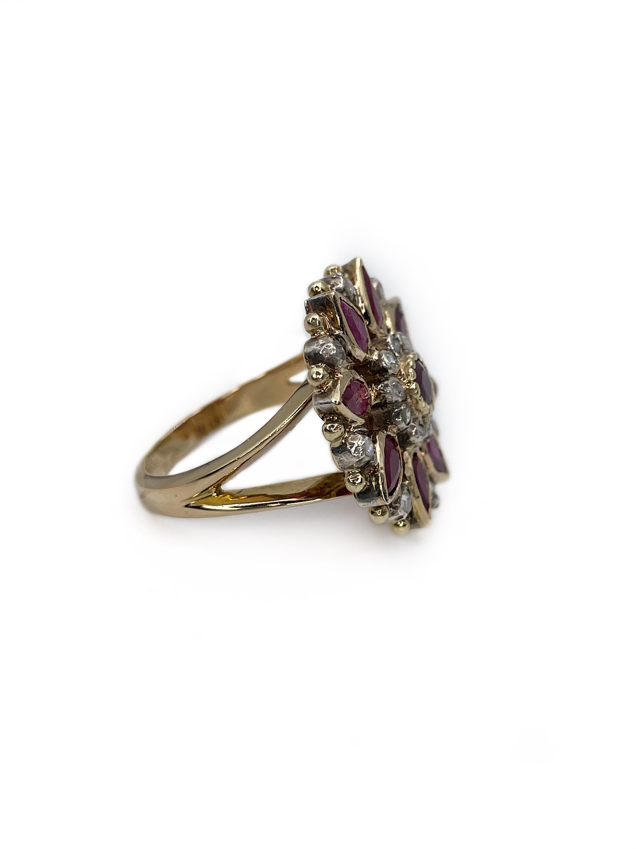 This is a magnificent Victorian ring crafted in 18K (shank) and 14K (head) gold. It is adorned with 925 hallmark silver. The piece features 9 rubies, that in total weight ~2.14ct (H, F). The gems are accompanied with 18 rose cut diamonds (~0.27ct,
