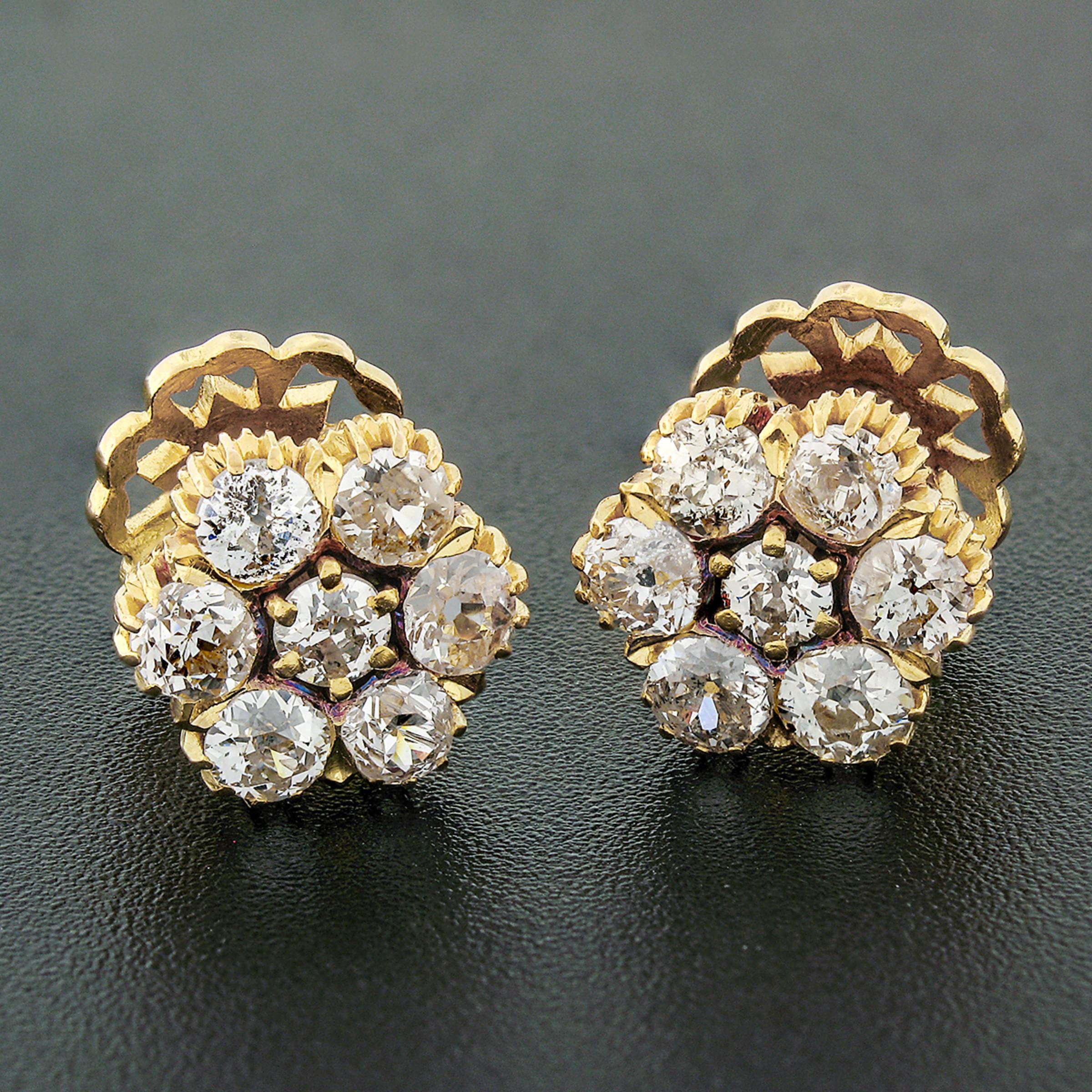 These RARE fancy antique earrings are crafted in solid 18k yellow gold and feature a lovely cluster flower design set with 4 old cut diamonds throughout. The diamonds are old mine and European cut stones, neatly sitting in multi-prong settings