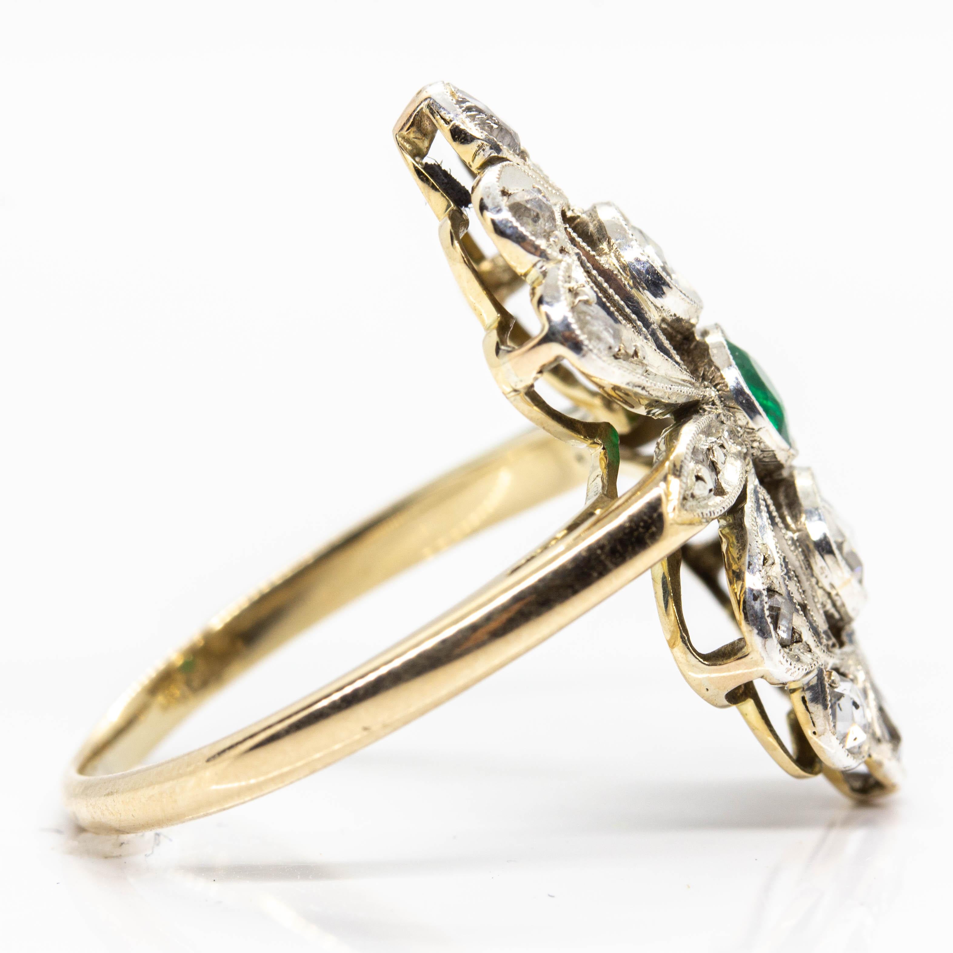 Period: Victorian (1836 – 1900)
Composition: 18k Gold and Silver
•	1 natural emerald 0.40ctw.
•	14 rose cut diamonds J-SI1 0.90ctw.
Ring size: 7 ½ 
Ring face measure: 20mm x 17mm 
Rise above finger: 5mm
Total weight: 4.2 grams – 2.7dwt
