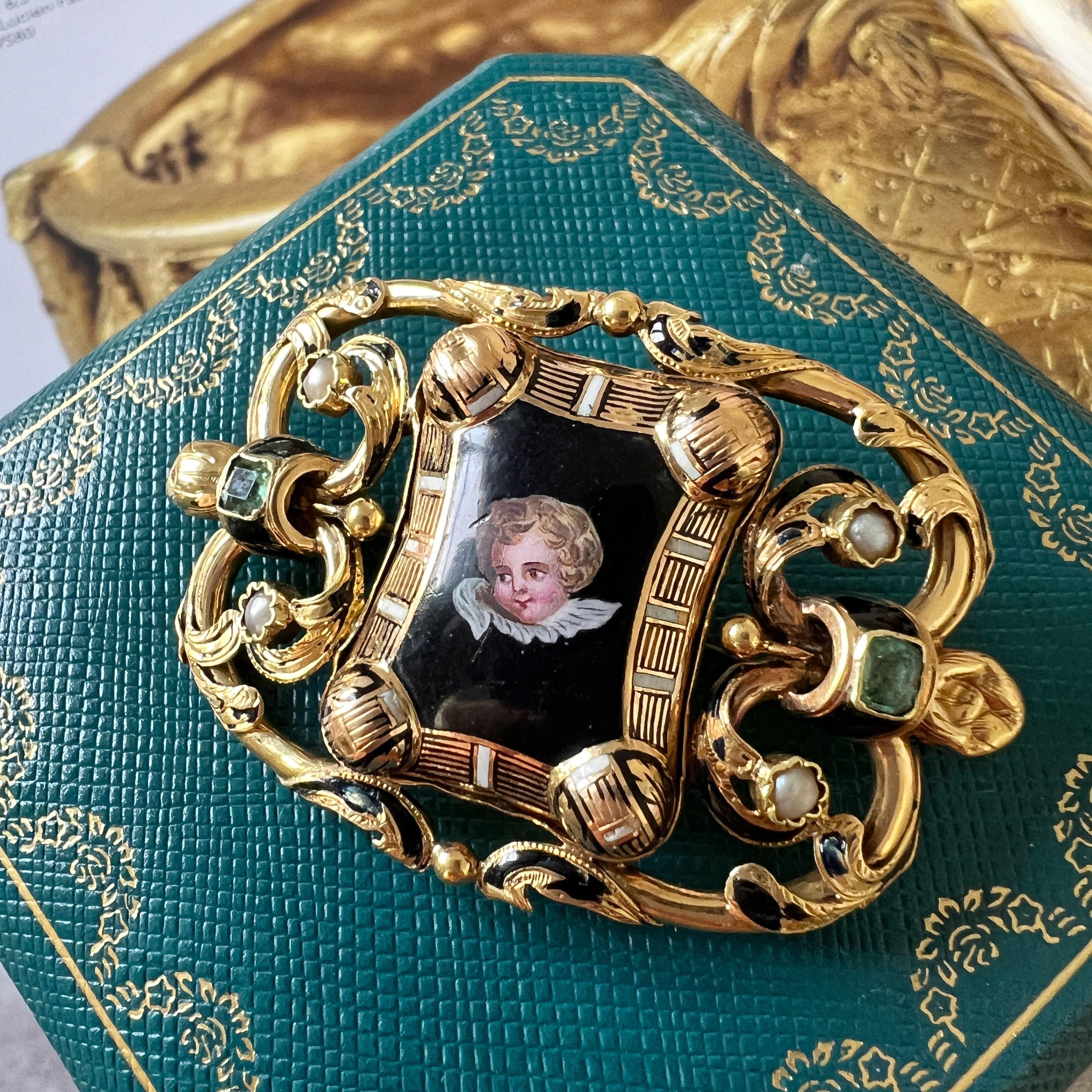For sale a Victorian era, 18K gold brooch capturing the timeless charm of an enamored cherub, delicately hand-painted with intricate detail. Nestled amidst a canvas of fine enamel, this cherub conveys an aura of innocence and playfulness, with rosy