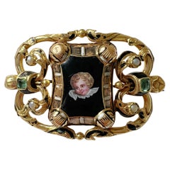 Antique Victorian 18K gold cherub brooch with emeralds and natural pearls