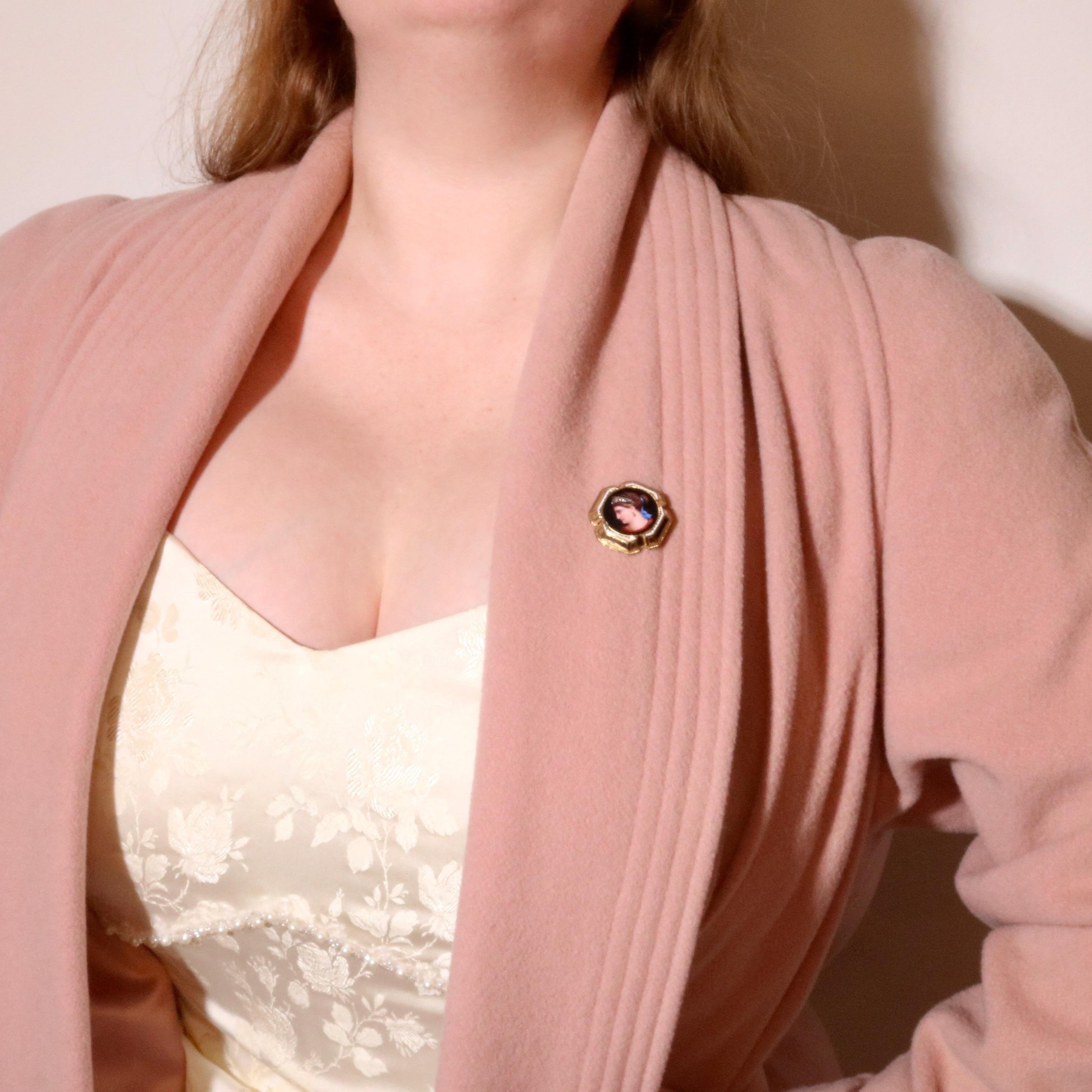 A Victorian yellow gold, diamond, and enamel brooch, comprising three rose cut diamonds, and hand painted enamel, in 18 karat yellow gold, with silver pin. 

This exquisite Victorian brooch is centred around a circular panel, depicting an elegant