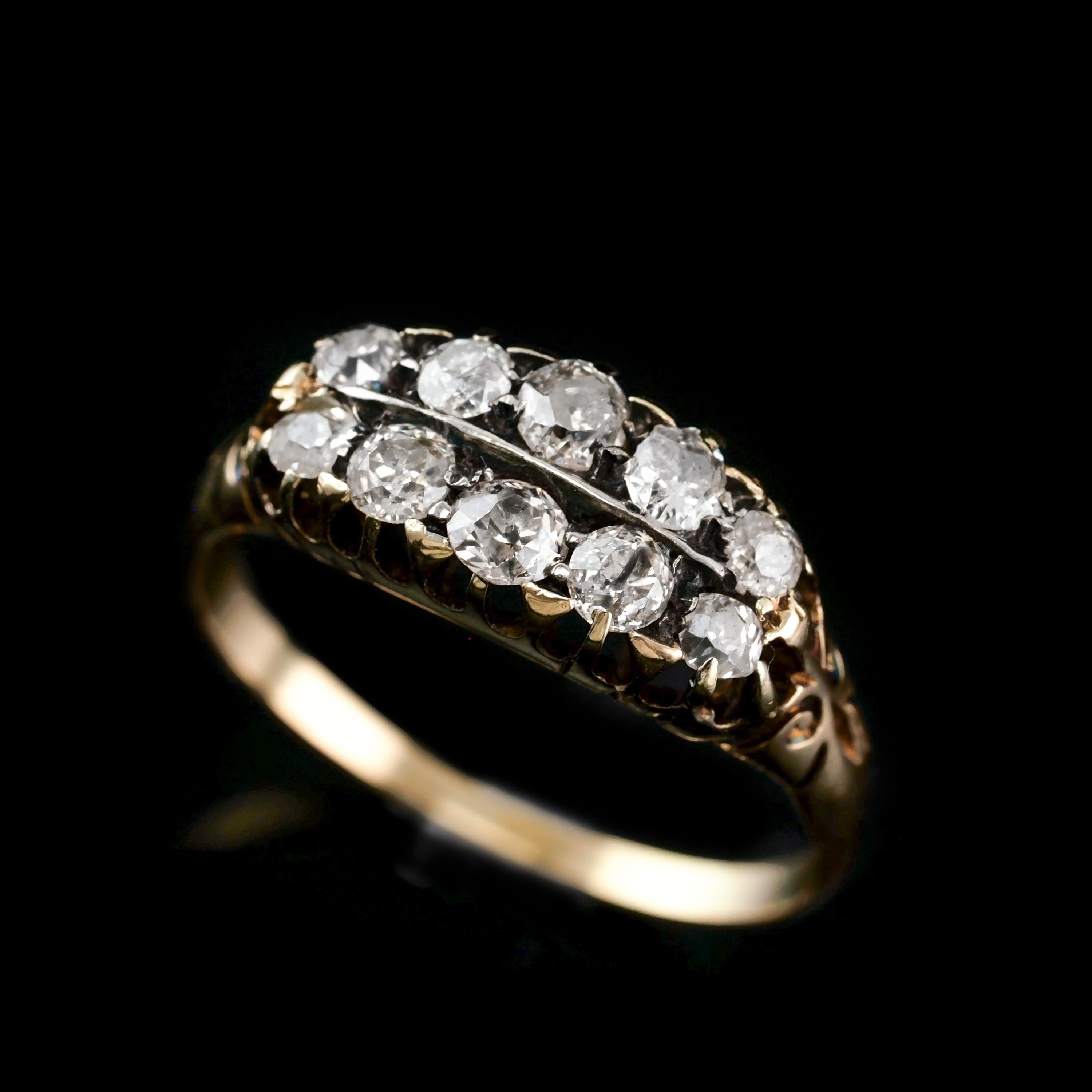 We are delighted to offer this fabulous Victorian 18K gold ring with a dual row of antique old cut diamonds made c.1890.
   
Distinctly Victorian and distinguished from contemporary pieces, 10 diamonds (approx 0.7 carat total) are set in two rows