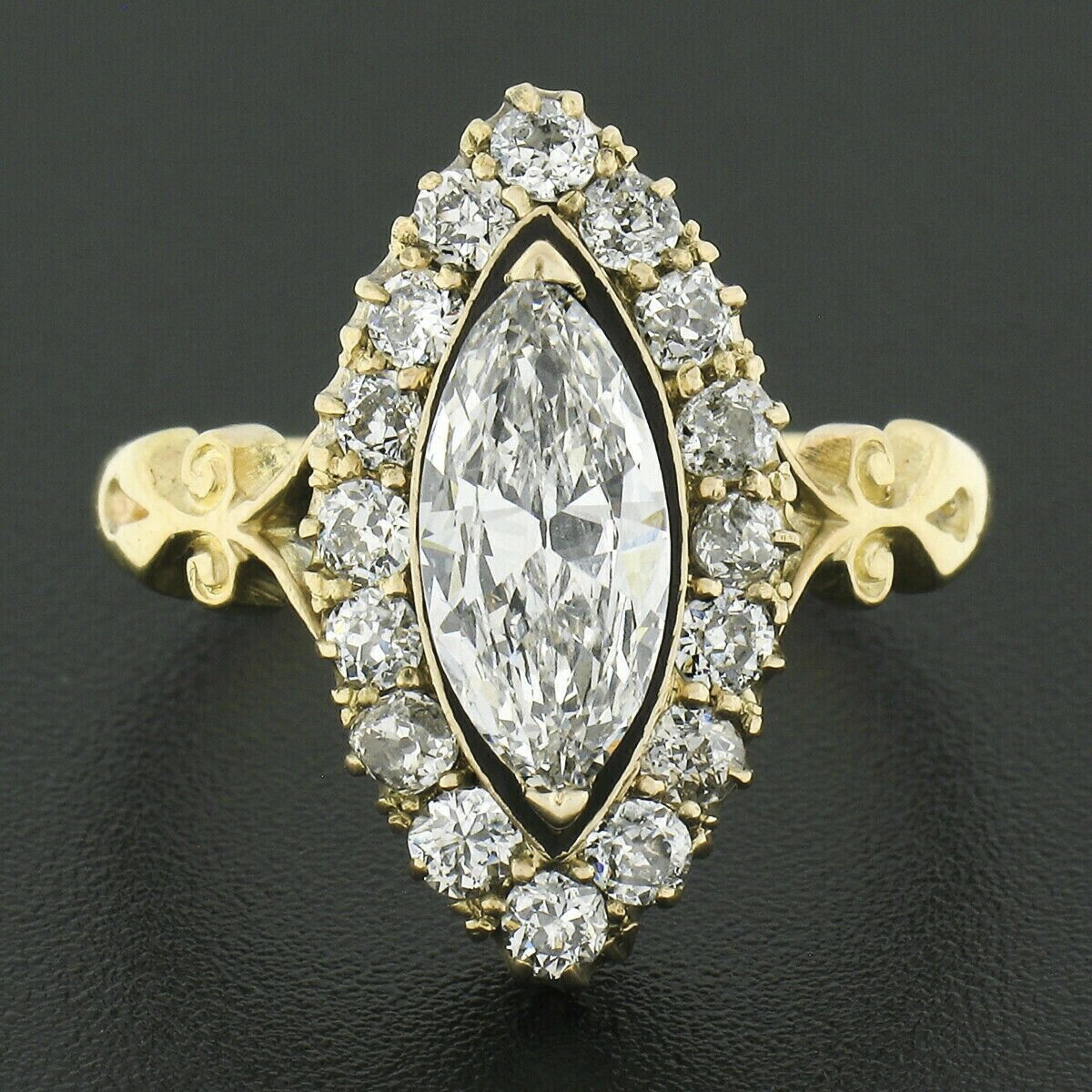 Here we have an absolutely breathtaking and super rare antique engagement ring that was crafted from solid 18k yellow gold dating to the mid 1800's. It features a very fine quality marquise cut diamond solitaire that has been certified by GIA as