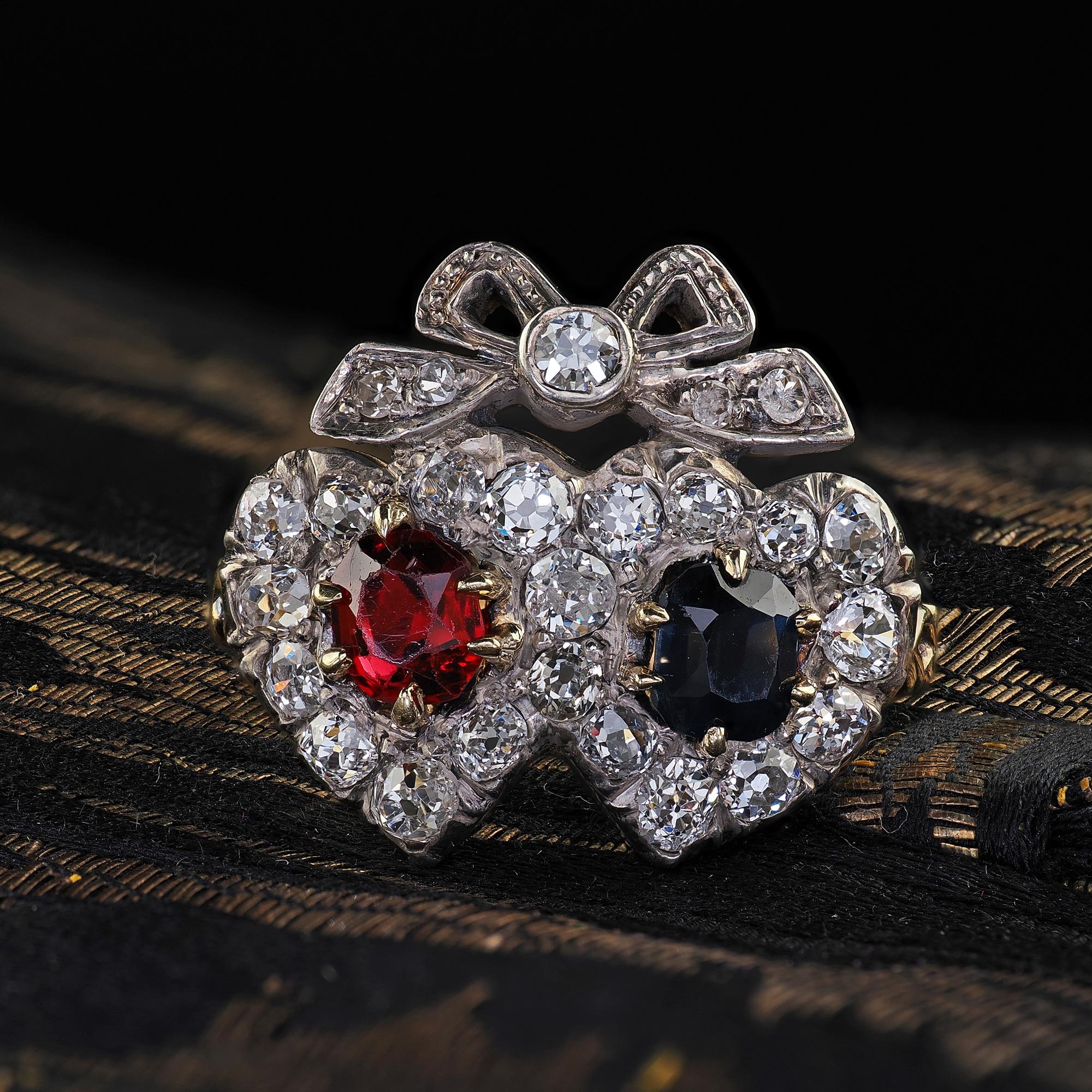 Beautiful Antique Victorian 18K Gold Old Mine Diamond Ruby Sapphire Double Heart Ring. This incredible Victorian old mine diamond double heart ring is crafted in 18k yellow gold and silver top. This gorgeous ring features old mine cut diamonds set