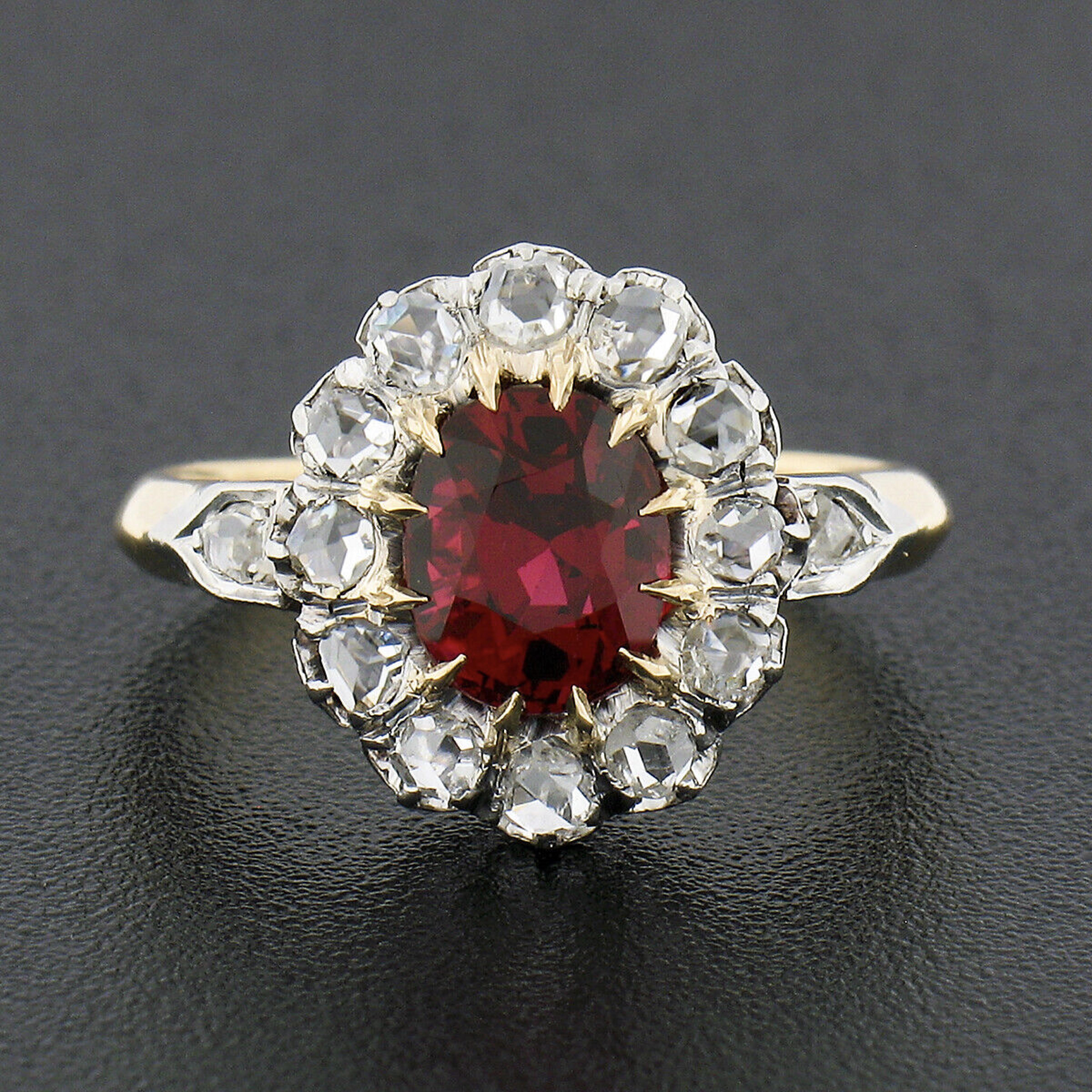 This truly breathtaking antique ring was crafted during the Victorian era from solid 18k yellow gold with a platinum top. It features an elegant flower cluster design set with a, GIA certified, natural spinel stone at its center. This gorgeous