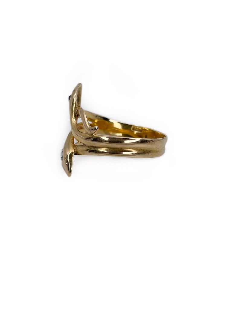This is a typical Victorian ring crafted in 18K gold. It depicts two snakes. The piece features two rose cut diamonds (0.09ct, RW, SI-P1). The ring is silky smooth.

When Prince Albert gave Queen Victoria a snake ring, it started a trend of giving