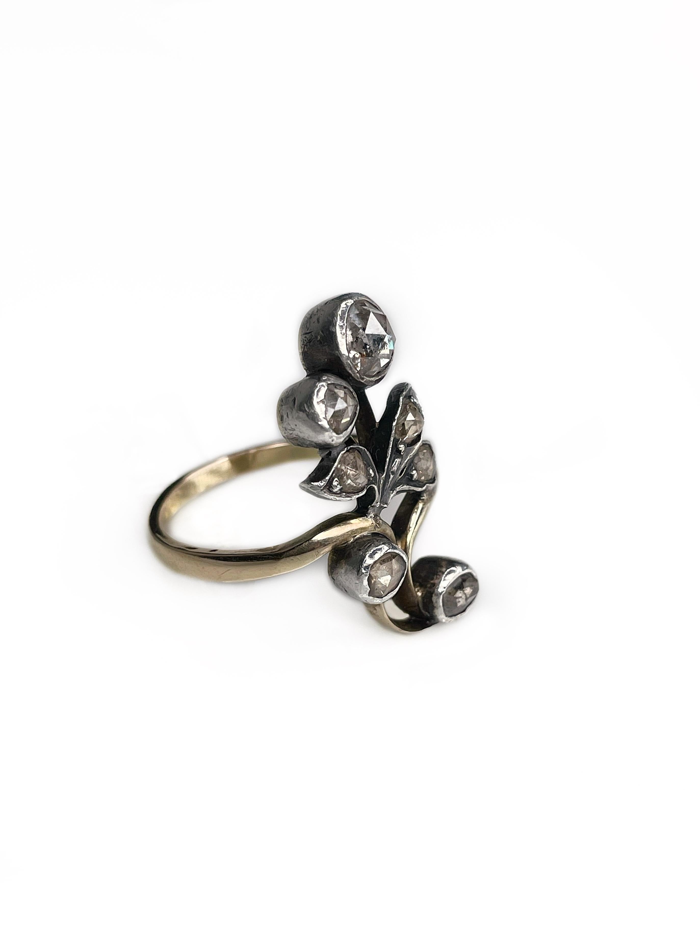 This is an antique Victorian floral design navette ring crafted in 18K gold and adorned with silver. The piece features 7 rose cut diamonds. It is a real treasure for all who seek something special or adore Victorian jewelry. 

Weight: 5.23g
Size:
