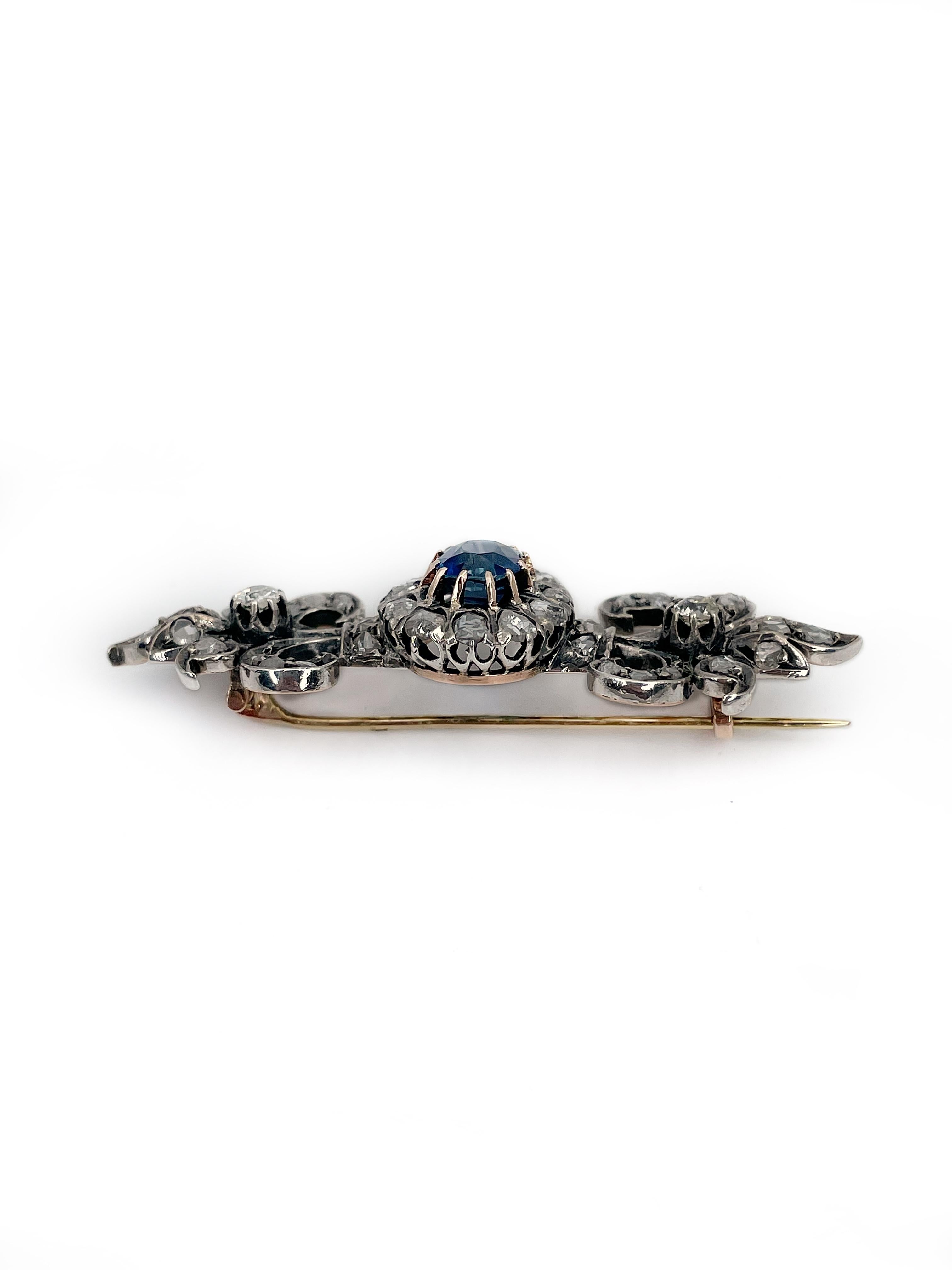 This is a magnificent Victorian Fleur-de-lis design pin brooch crafted in 18K gold. It is adorned with silver. The piece features oval natural blue sapphire in the center. The gem is accompanied by a mixture of old and rose cut diamonds.

Weight: