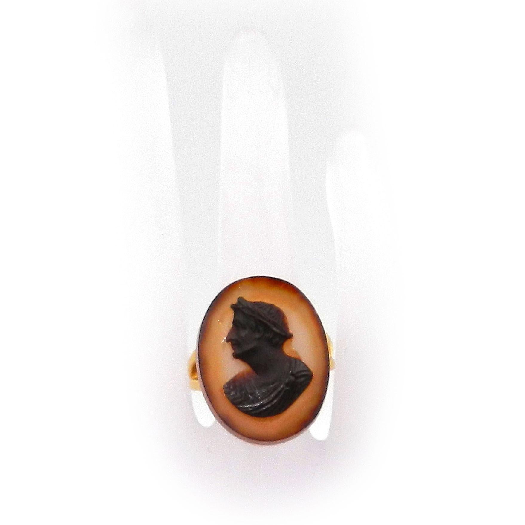 Antique Victorian 18K Gold Tiberius Paste Cameo Ring Sheffield 1893

This decorative gem ring is made of 18K/750 yellow gold and was created in England around 1900. The smooth, solid ring band with an oval ring head is set with a gem made of glass