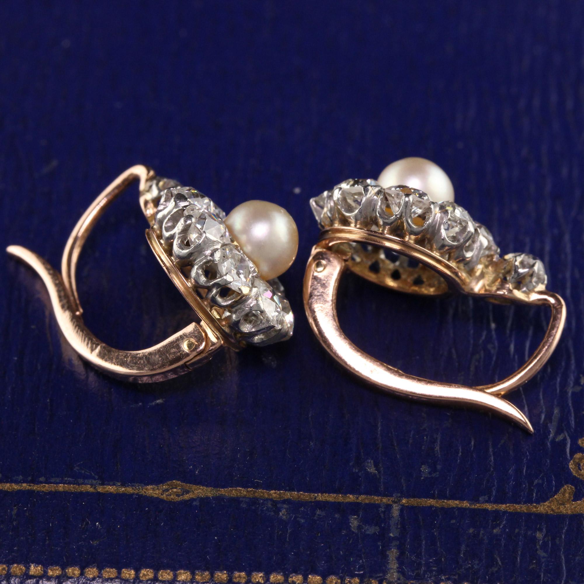 Gorgeous Antique Victorian 18K Rose Gold Platinum Top Old Mine Diamond and Pearl Earrings. These amazing victorian diamond earrings have old mine cut diamonds surrounding a natural pearl on each side. This is a gorgeous and classic style.

Item