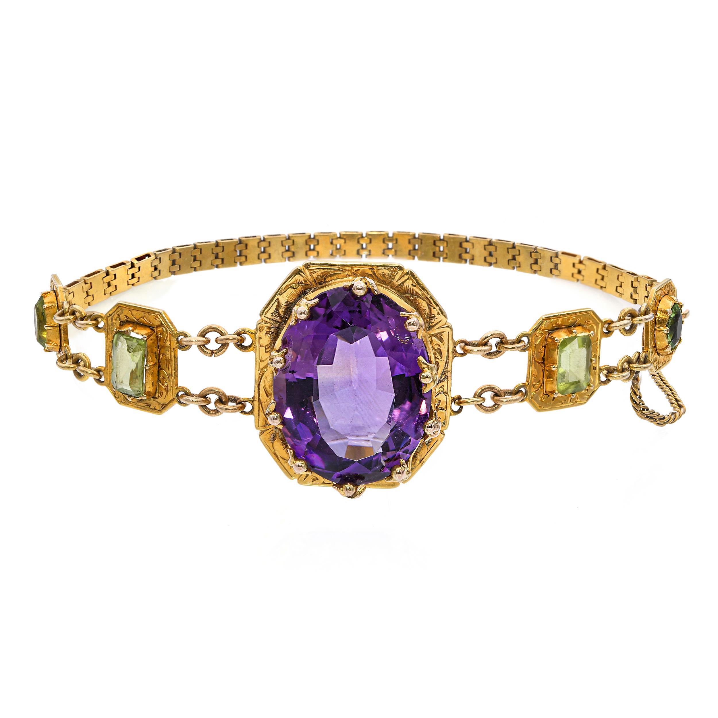 This stunning antique bracelet is crafted in rich 18k yellow gold and showcases a vibrant combination of amethyst and peridot gemstones. The stones are beautifully arranged in an intricate, detailed gold setting that highlights their vivid purple