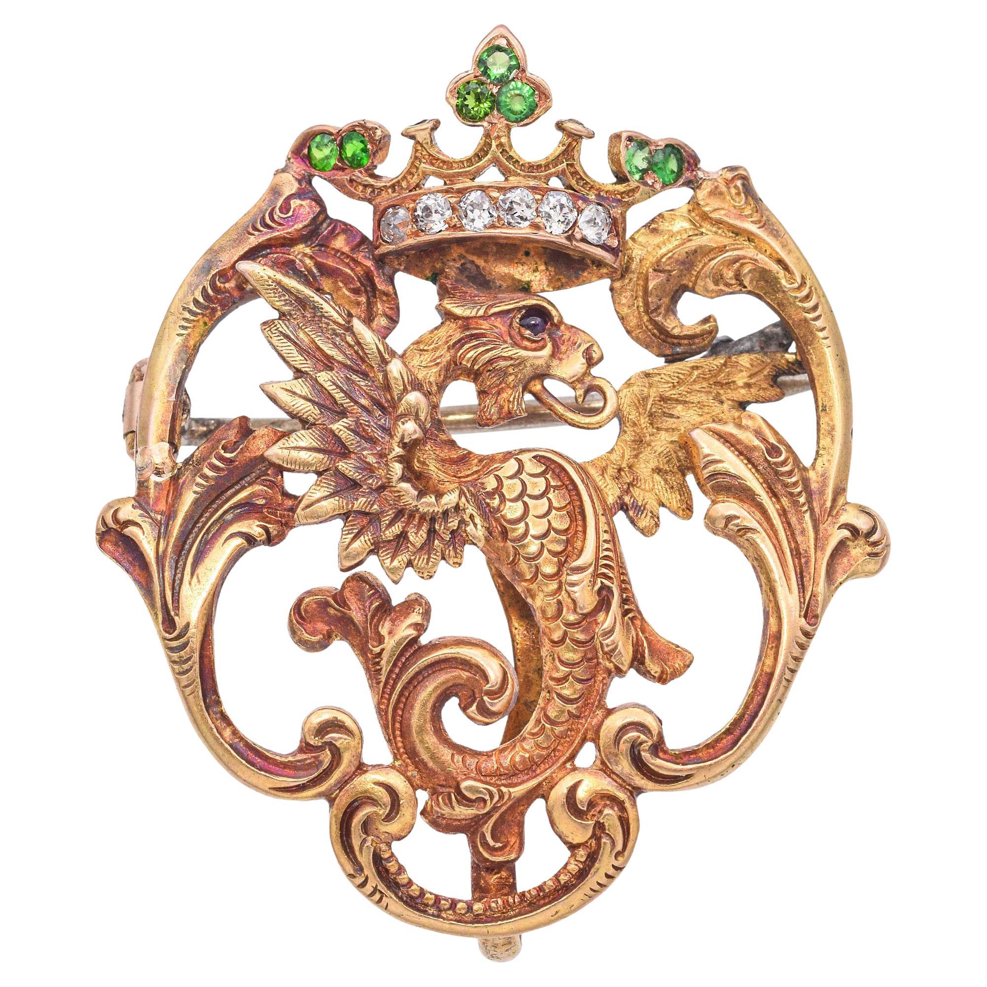 Antiguo broche victoriano de oro amarillo de 18 quilates con granate demantoide y grifo de diamantes