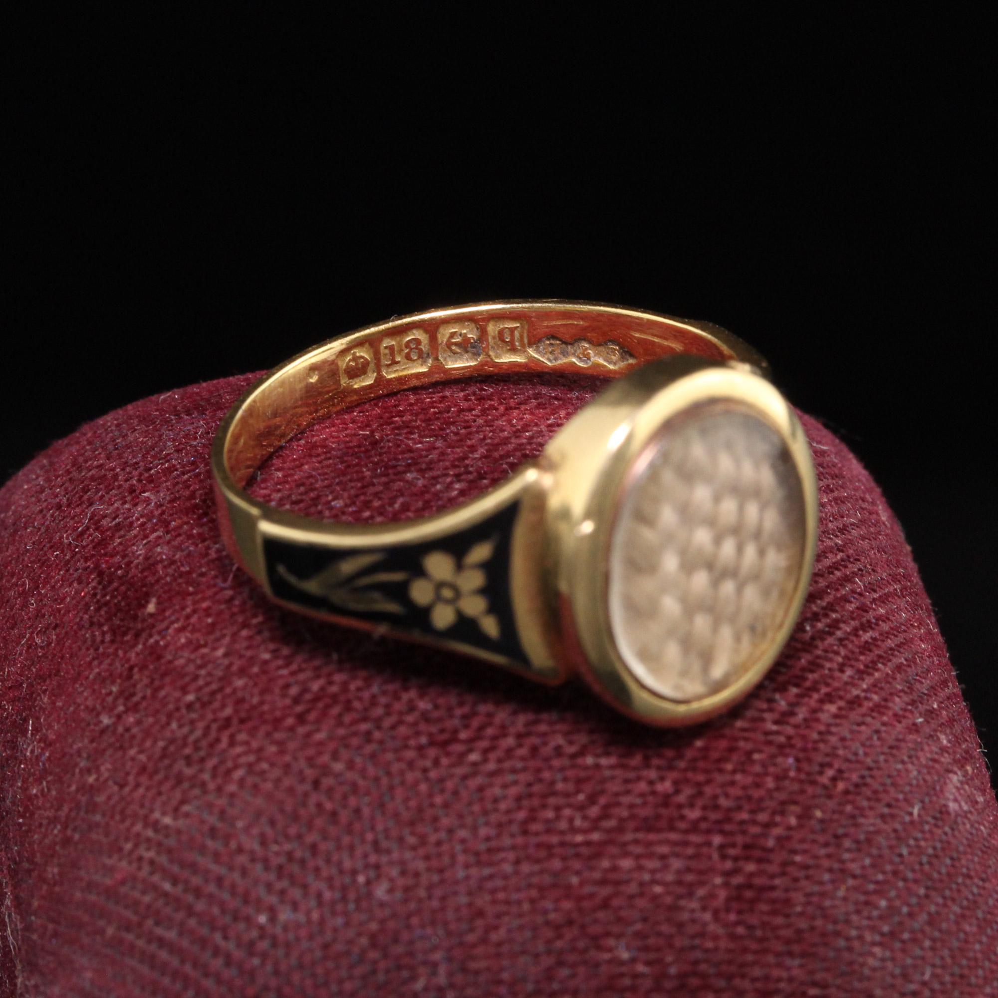 Beautiful Antique Victorian 18K Yellow Gold Enamel Hair Mourning Ring. This amazing ring has pristine enameling and the hair is still intact inside the glass. It has flower designs on the side of the ring without any damage which is rare. The inside