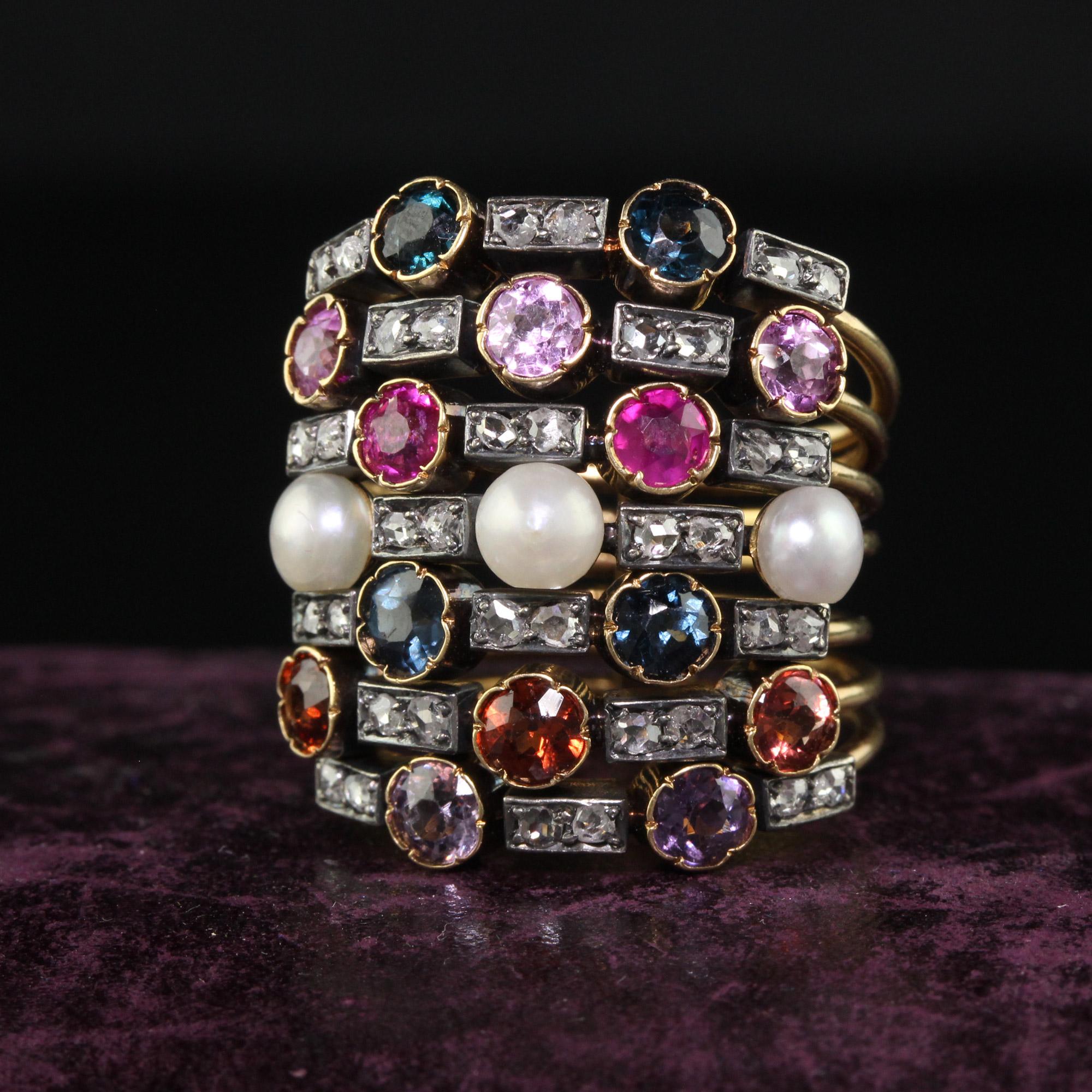 Beautiful Antique Victorian 18K Yellow Gold Multi Sapphire Pearl Ruby and Diamond Harem Ring. This incredible harem ring is crafted in 18k yellow gold and silver top. There are a colorful array of sapphires, diamonds, and pearls on this incredible