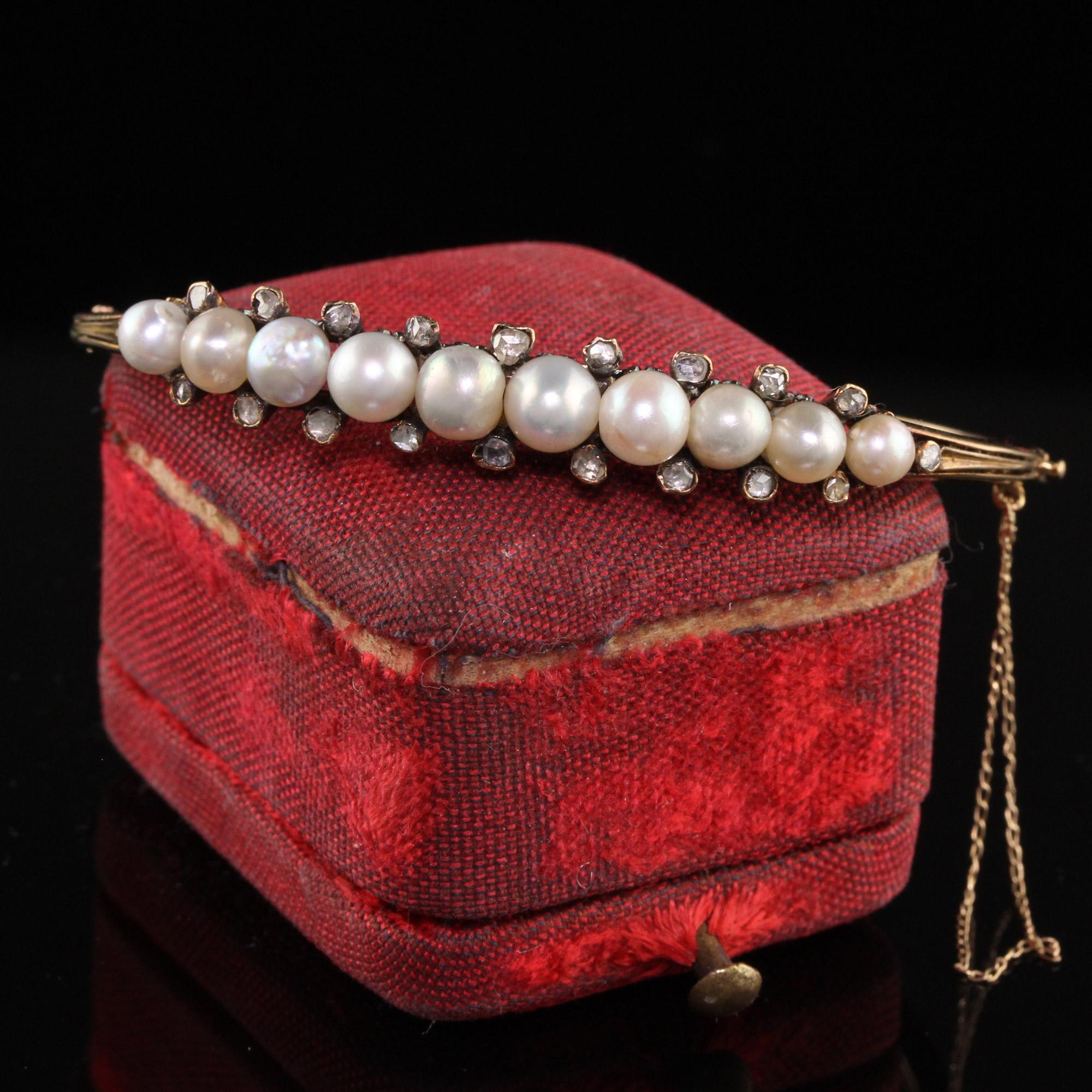 Beautiful Antique Victorian 18K Yellow Gold Natural Pearl Rose Cut Diamond Bangle. This beautiful bangle bracelet is crafted in 18k yellow gold. The top holds ten natural pearls and has rose cuts above and below each one. One of the pearls looks to