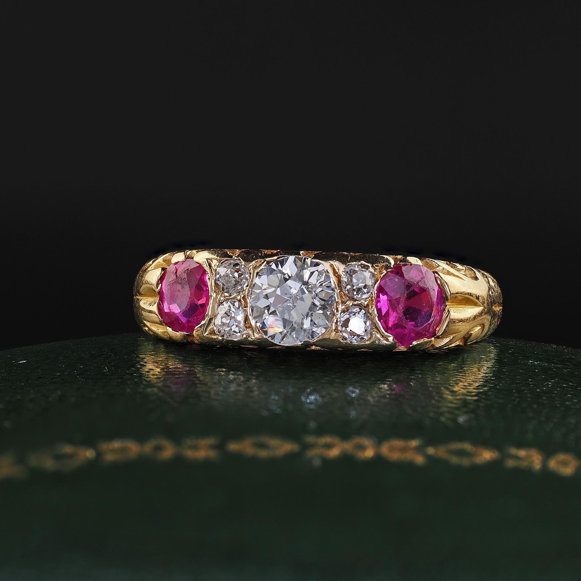 Beautiful Antique Victorian 18K Yellow Gold Old Cut Diamond and Ruby Three Stone Ring. This amazing Victorian diamond and ruby three stone ring is crafted in 18k yellow gold. This beautiful ring features an old cut diamond in the center and two