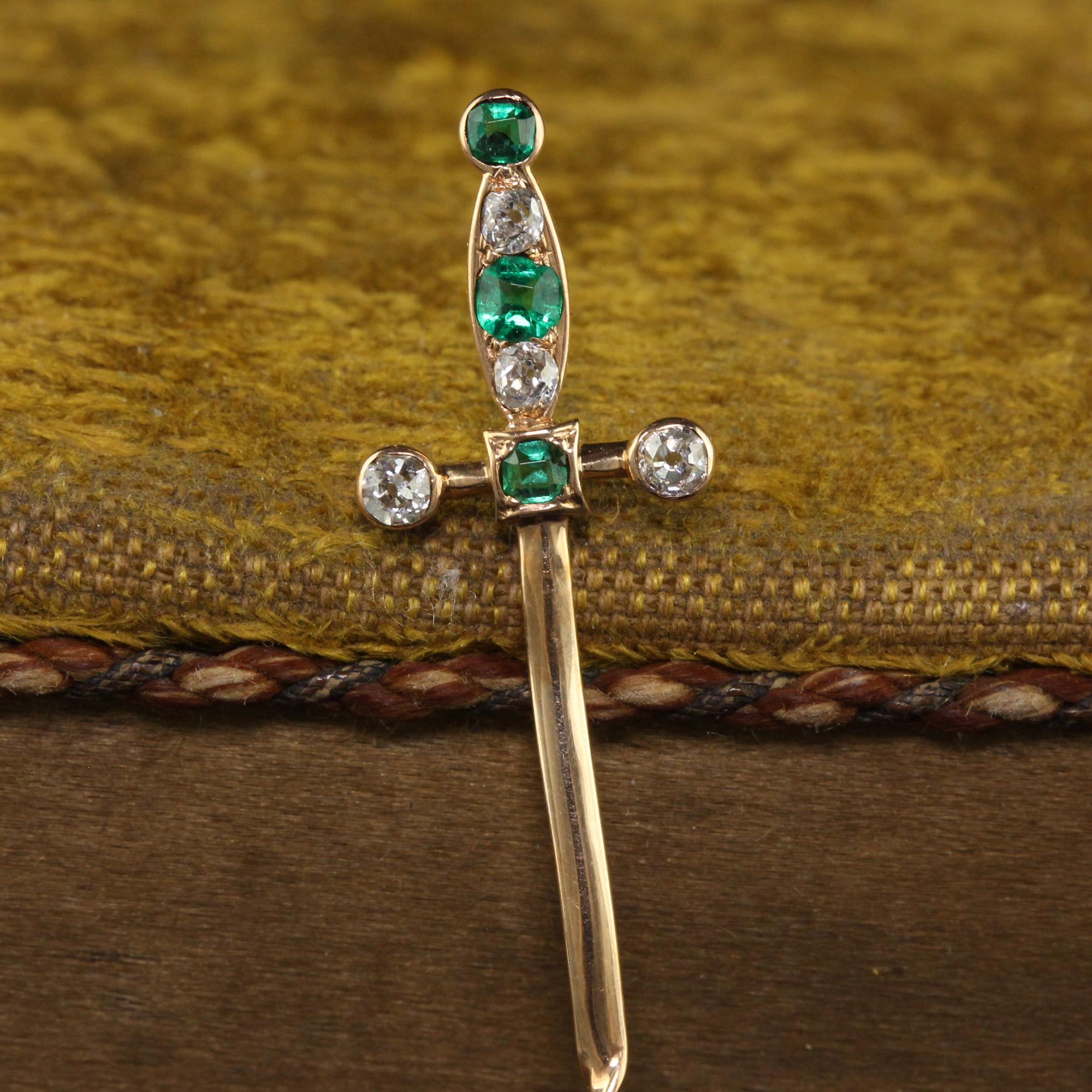 Beautiful Antique Victorian 18K Yellow Gold Old Cut Emerald and Diamond Sword Stick Pin. This gorgeous Victorian stick pin is crafted in 18k yellow gold. This incredible pic features a sword that has the handle and hilt adorned in natural emeralds