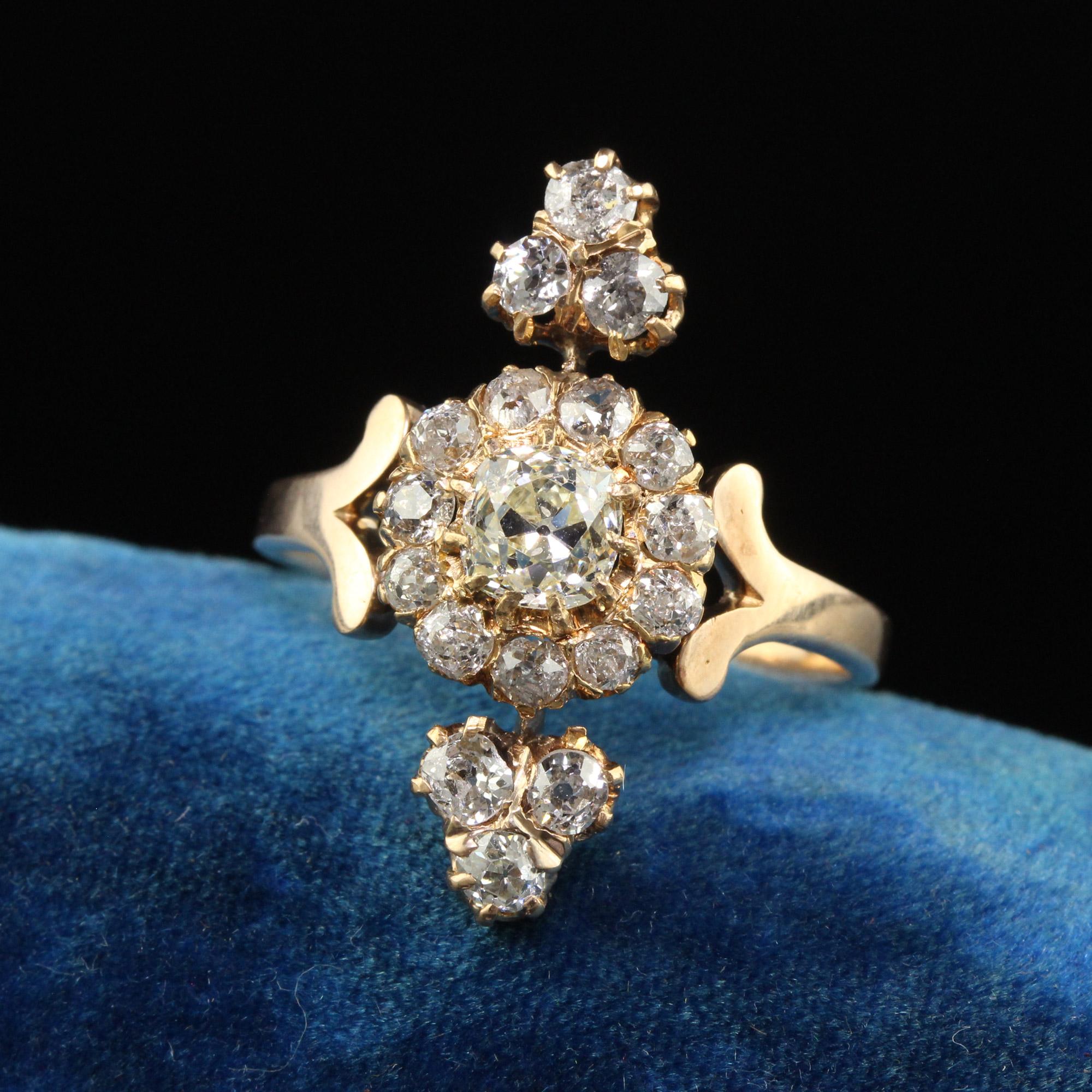 Beautiful Antique Victorian 18K Yellow Gold Old Mine Cut Diamond Cluster Cocktail Ring. This gorgeous Victorian cocktail ring is crafted in 18k yellow gold. The center holds a chunky old mine cut diamond with a yellow hue that is surrounded by white