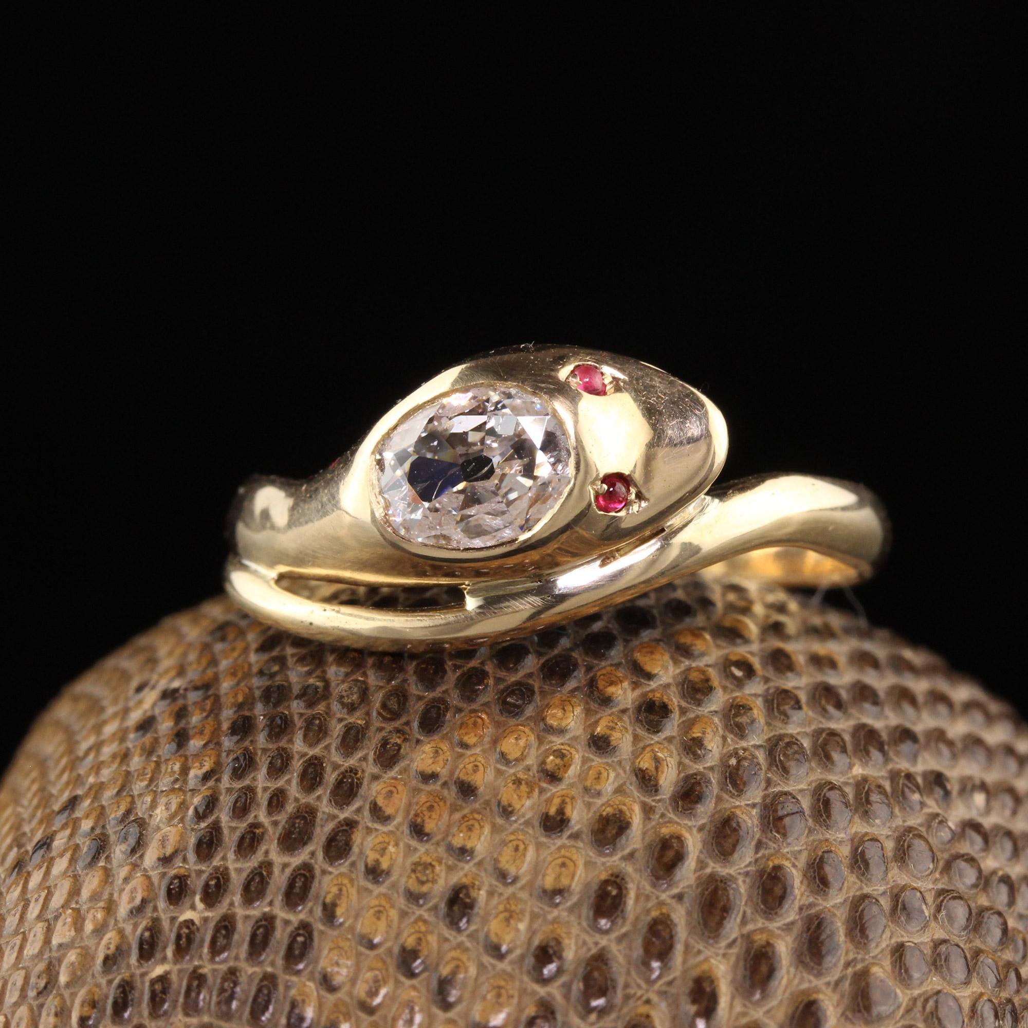 Beautiful Antique Victorian 18K Yellow Gold Old Mine Cut Diamond Snake Ring. This beautiful ring is crafted 18k yellow gold. The head of the snake has an old mine cut oval diamond on it that is flat and appears larger than it is. The eyes of the