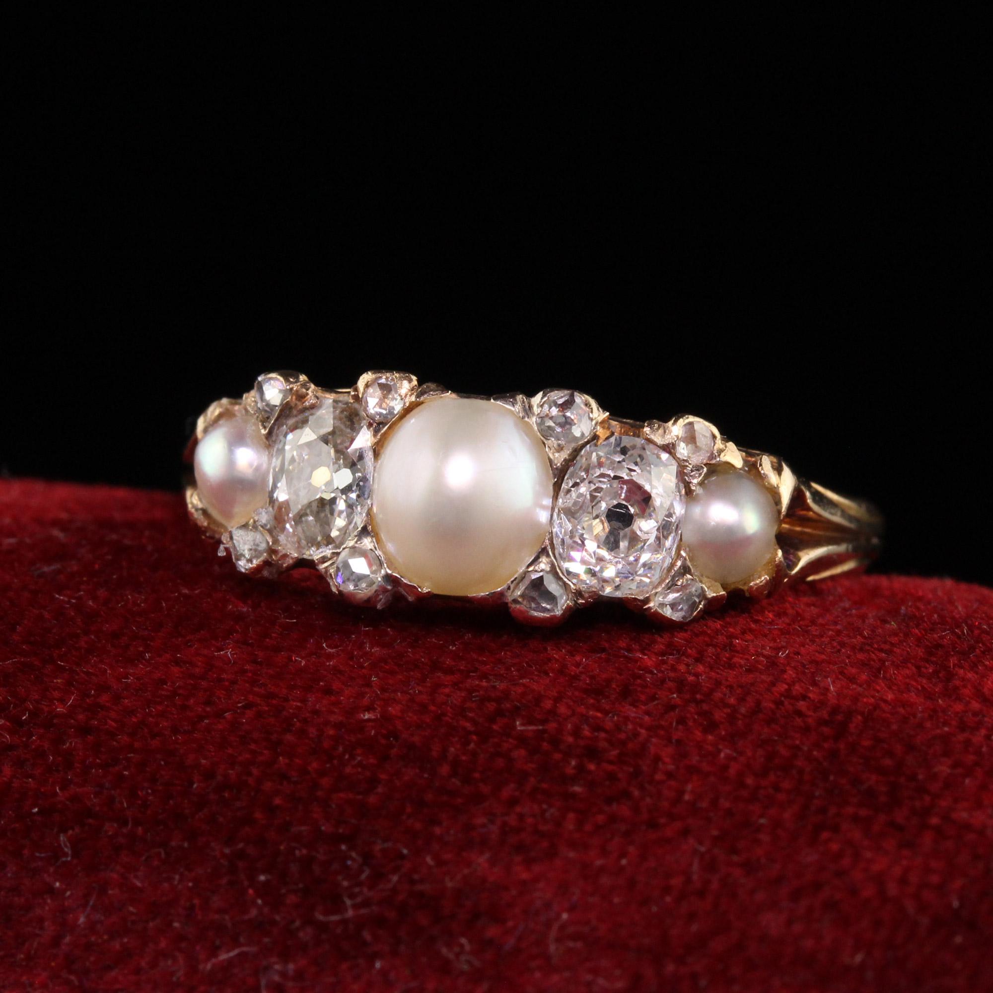 Beautiful Antique Victorian 18K Yellow Gold Old Mine Cut Natural Pearl Diamond Band. This gorgeous ring is crafted in 18k yellow gold. The top of the ring holds a natural pearl in the center and the sides with old mine cut diamonds and rose cut