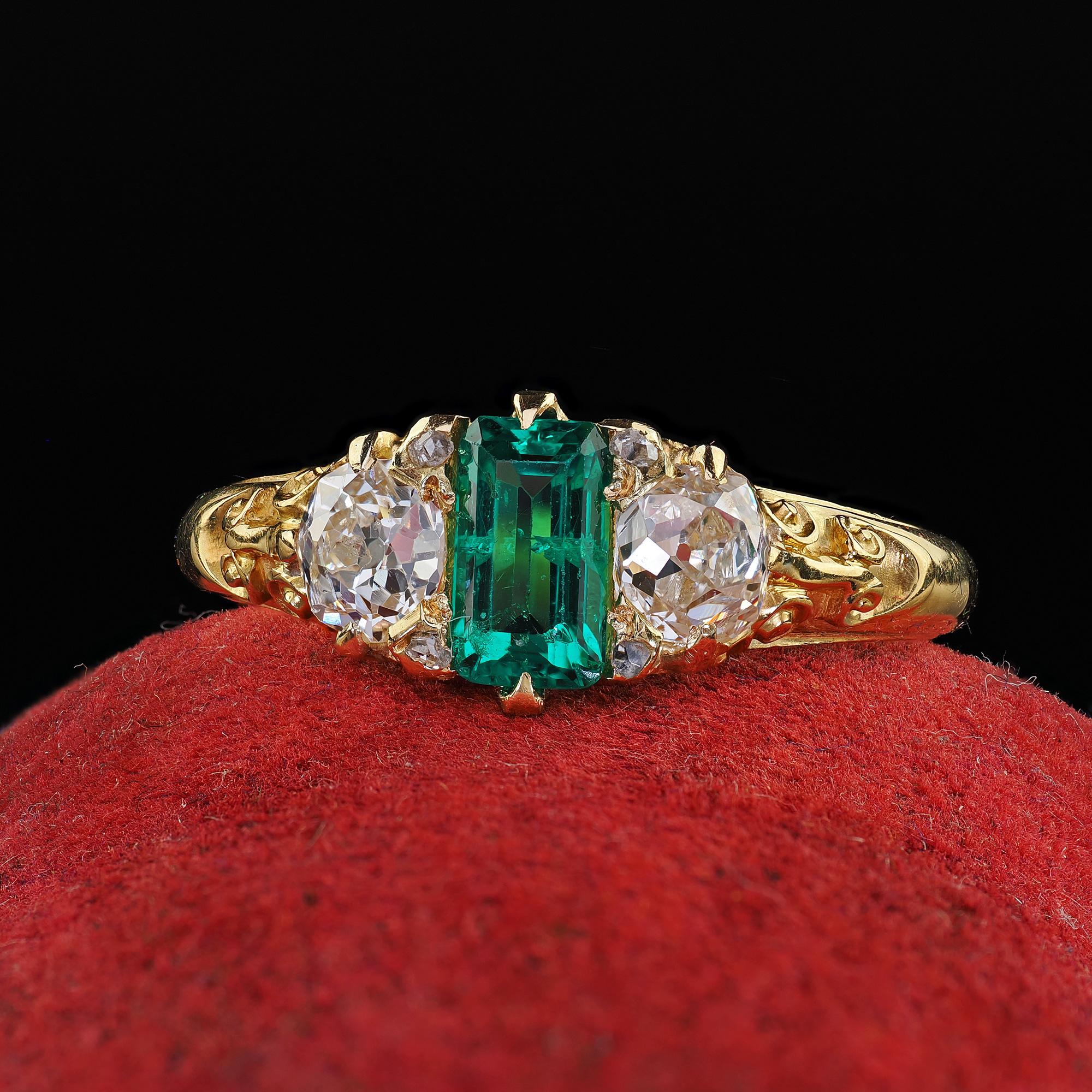 Beautiful Antique Victorian 18K Yellow Gold Old Mine Diamond and Colombian Emerald Ring. This incredible Victorian old mine diamond and Colombian emerald ring is crafted in 18k yellow gold. This ring features a finely saturated green Colombian