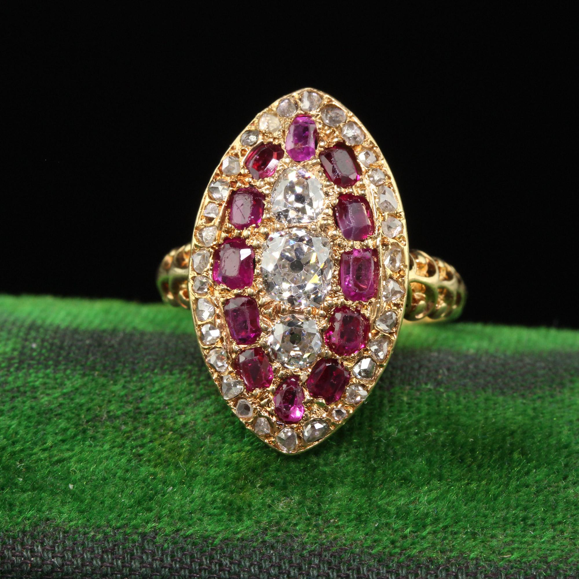 Beautiful Antique Victorian 18K Yellow Gold Old Mine Diamond and Ruby Navette Ring. This incredible Victorian diamond and ruby ring is crafted in 18k yellow gold. This ring features three old mine cut diamonds in the center that around surrounded by